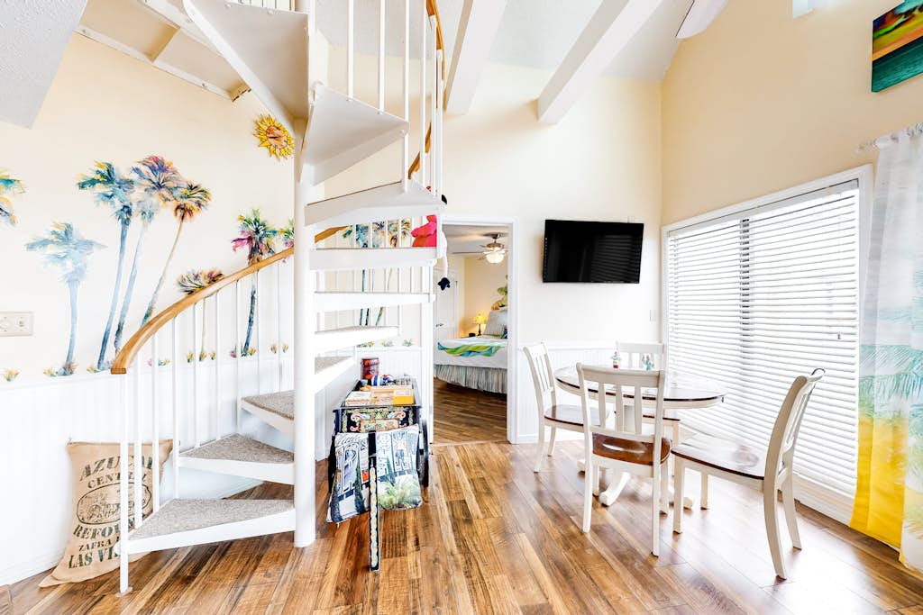 Colorful condo in beachfront complex with pools, gym, central AC & beach access