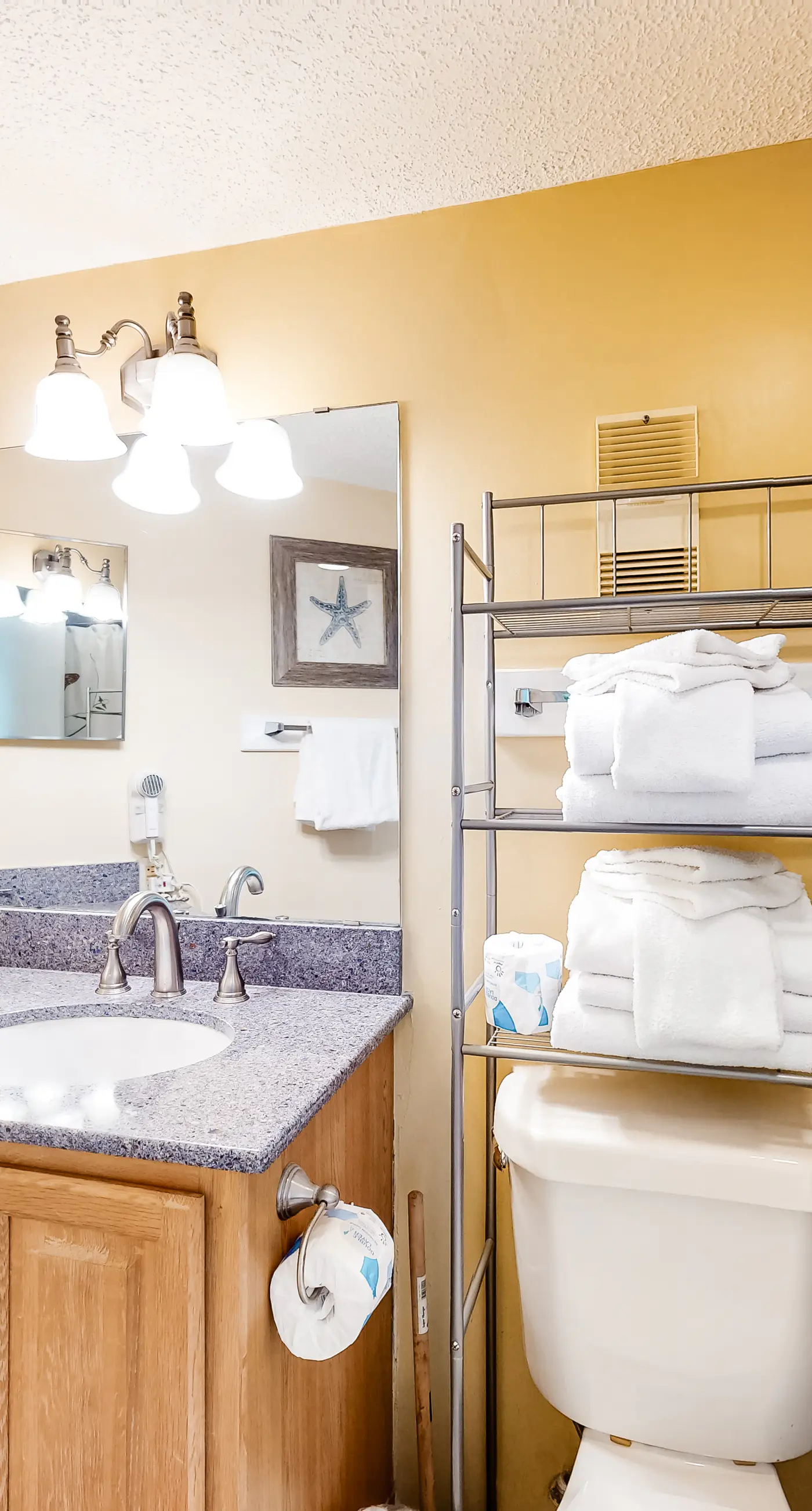 Colorful condo in beachfront complex with pools, gym, central AC & beach access