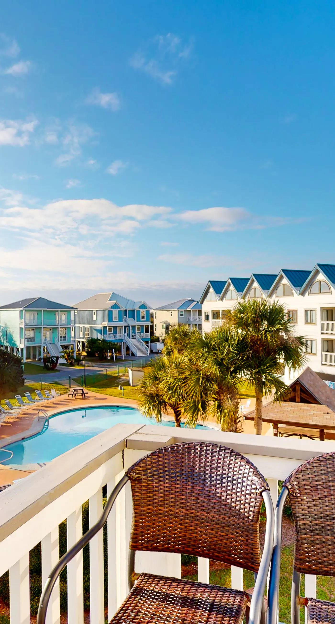 Colorful condo in beachfront complex with pools, gym, central AC & beach access