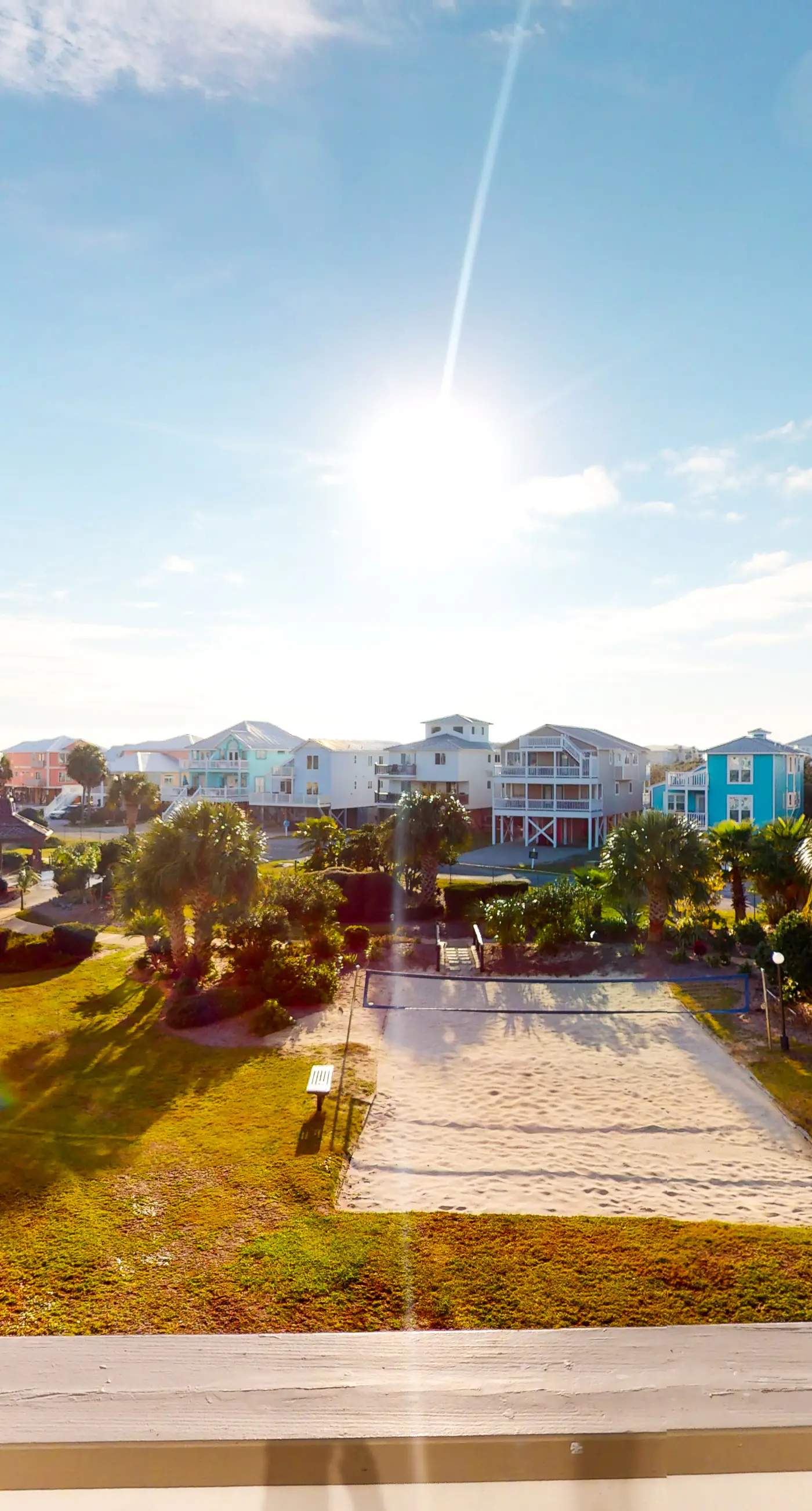 Colorful condo in beachfront complex with pools, gym, central AC & beach access
