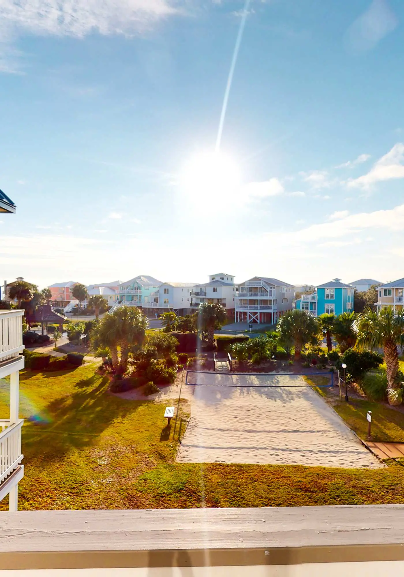 Colorful condo in beachfront complex with pools, gym, central AC & beach access
