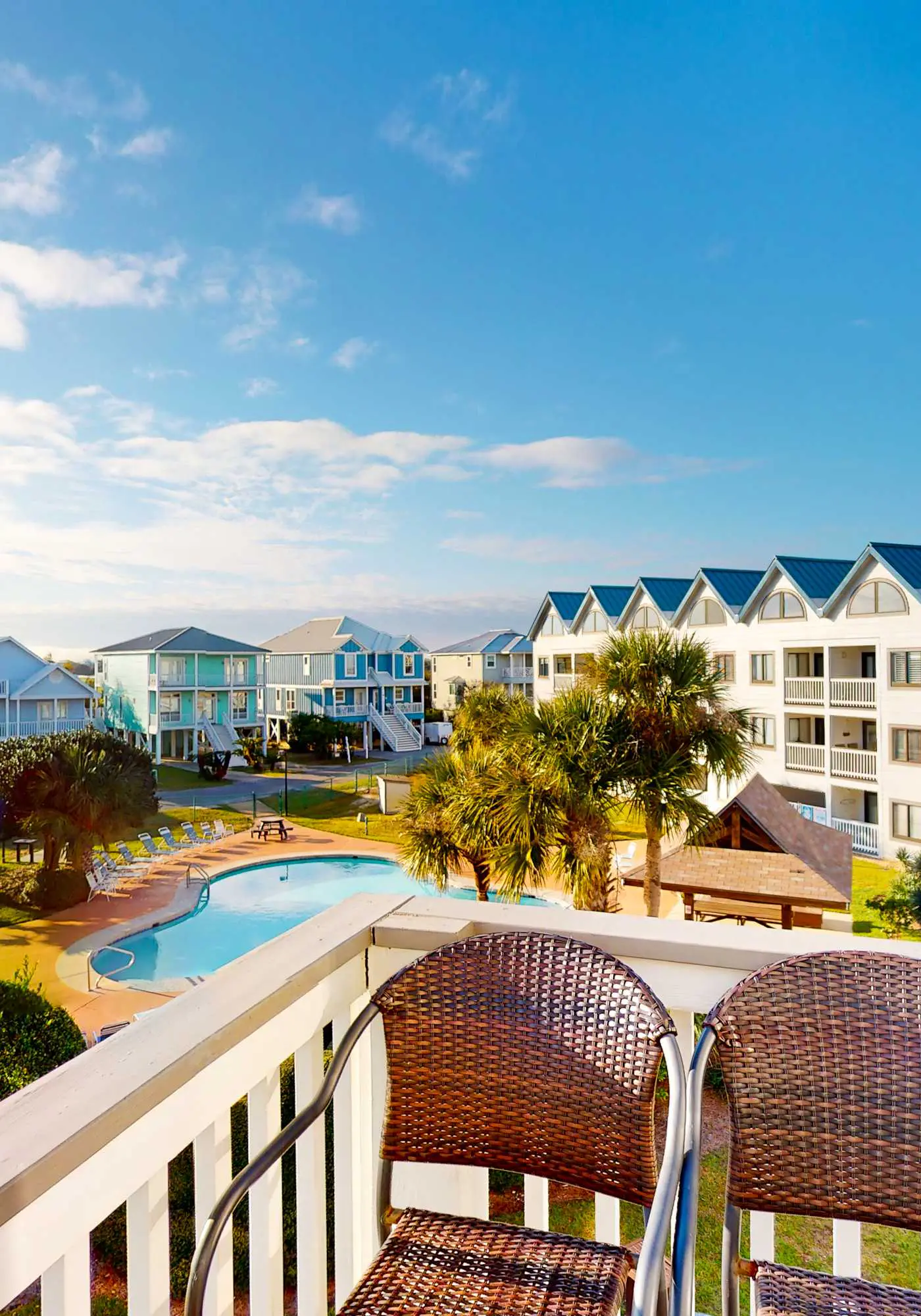 Colorful condo in beachfront complex with pools, gym, central AC & beach access