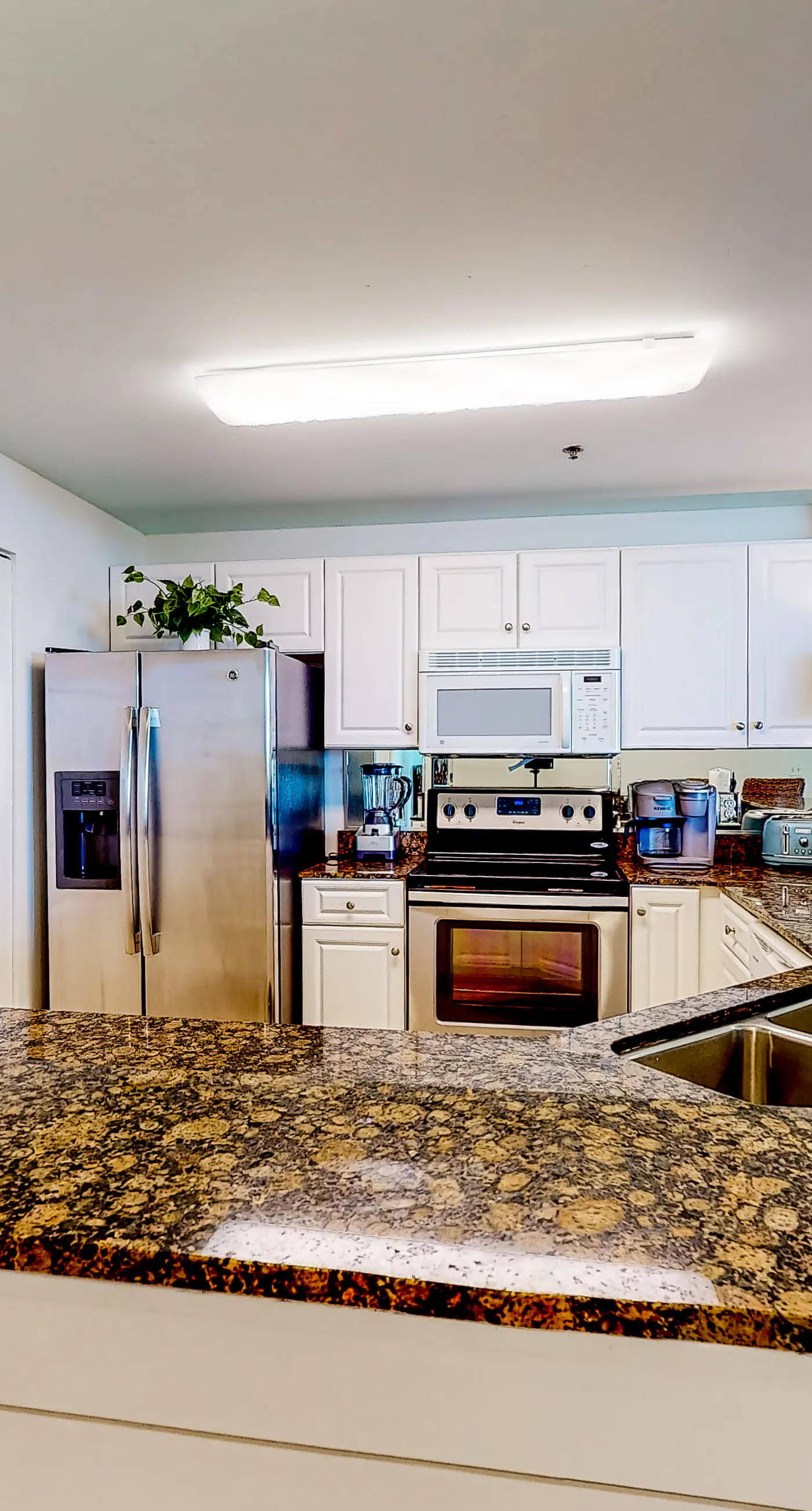 Peaceful water view condo with sauna, pool, tennis court, W&D, hot tub, & patio