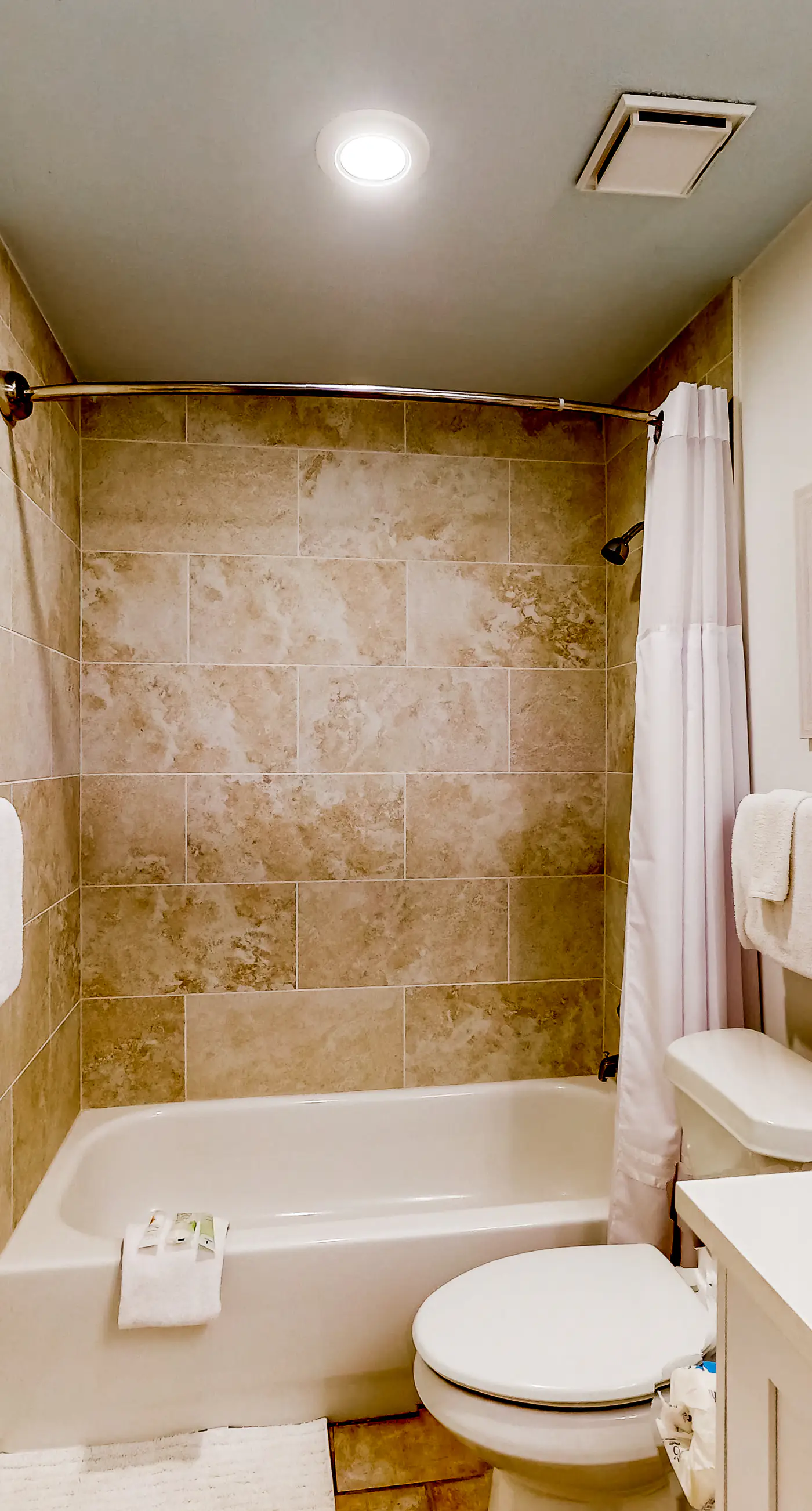 Peaceful water view condo with sauna, pool, tennis court, W&D, hot tub, & patio