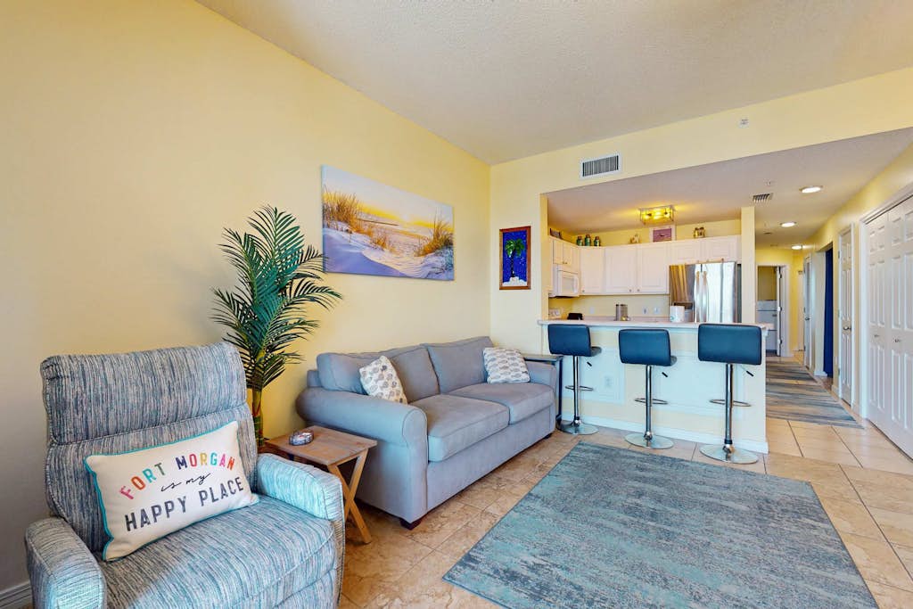 The Dunes 704 is a comfy beachside condo located on the quiet Fort Morgan peninsula. Enjoy beautiful Gulf views from the private balcony and easy beach access just a short walk away. Guests also have access to shared amenities including a swim-through indoor/outdoor pool, indoor pool spa, grilling area, and fitness center.