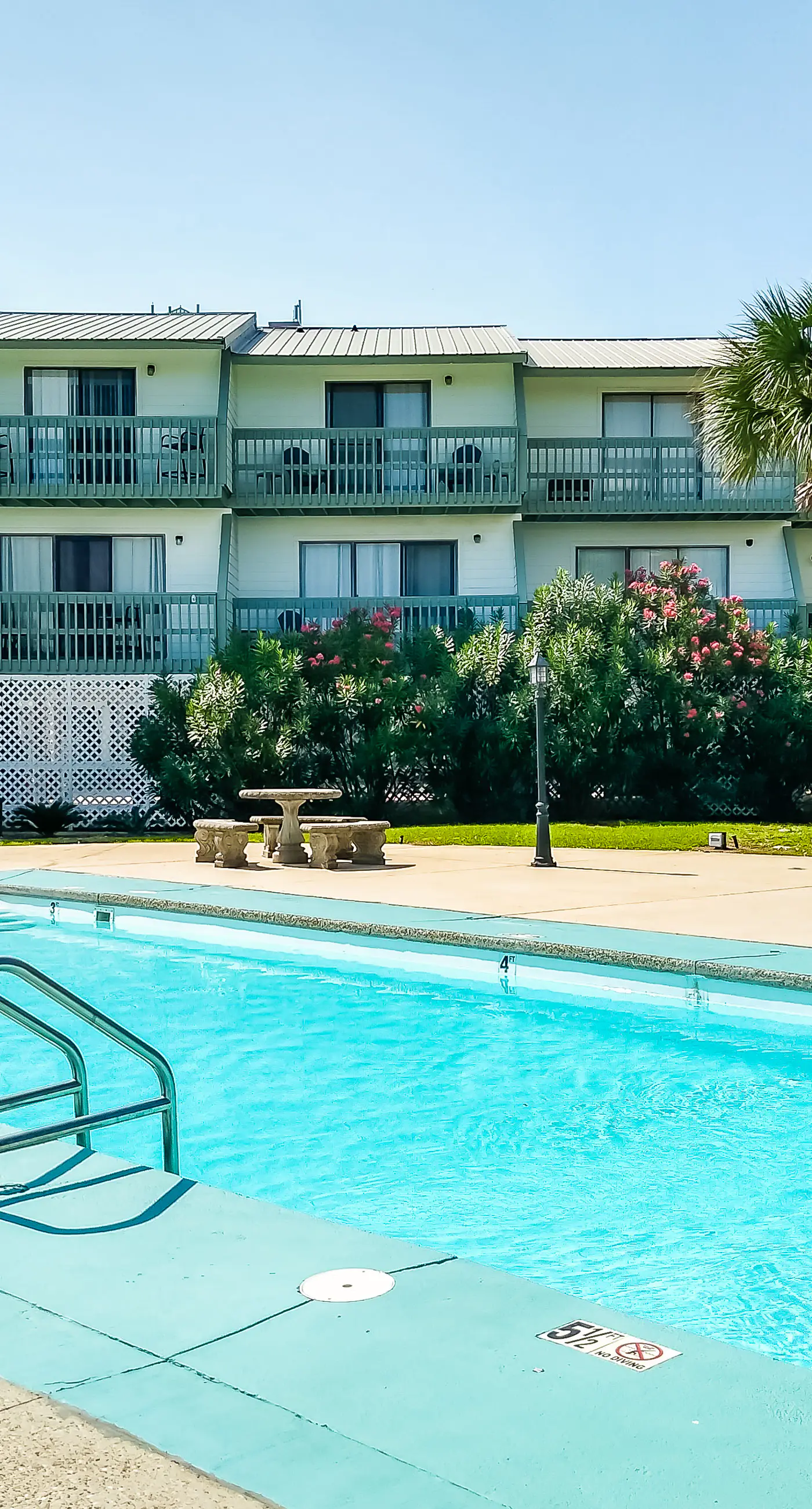 Renovated condo by the beach with pool access & private balconies