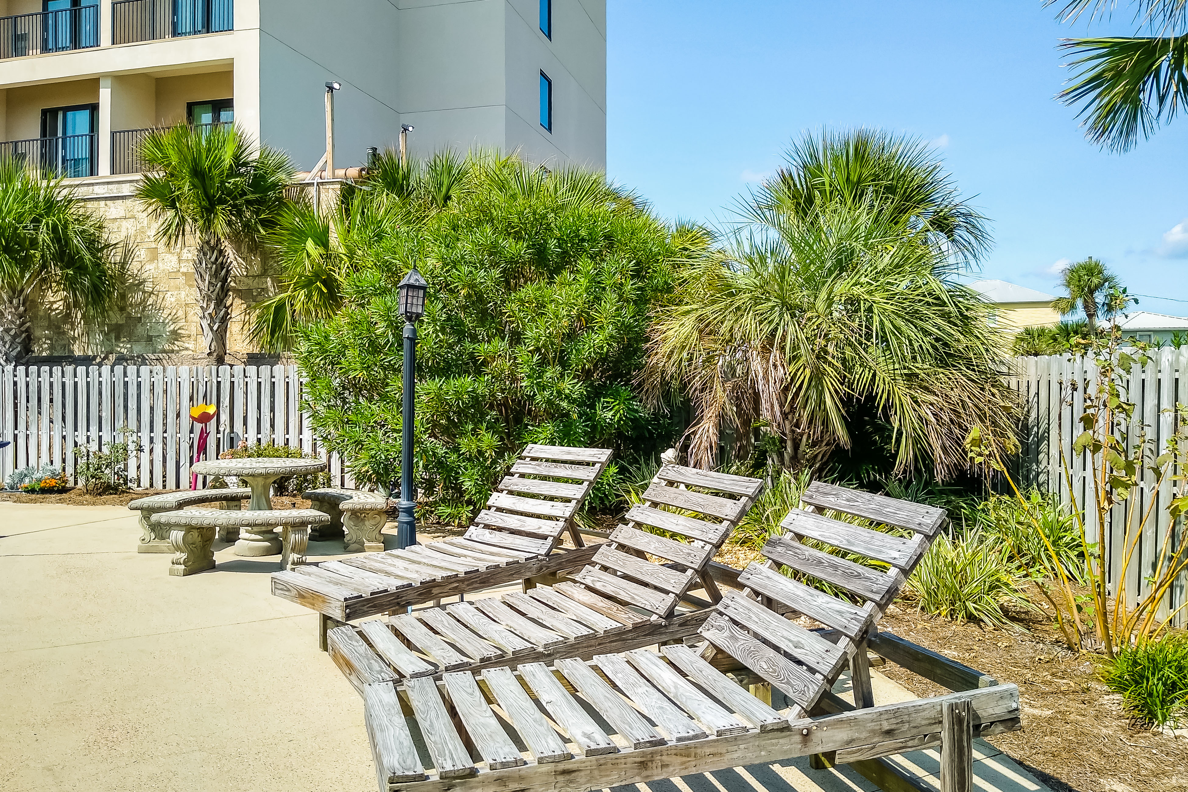 Renovated condo by the beach with pool access & private balconies