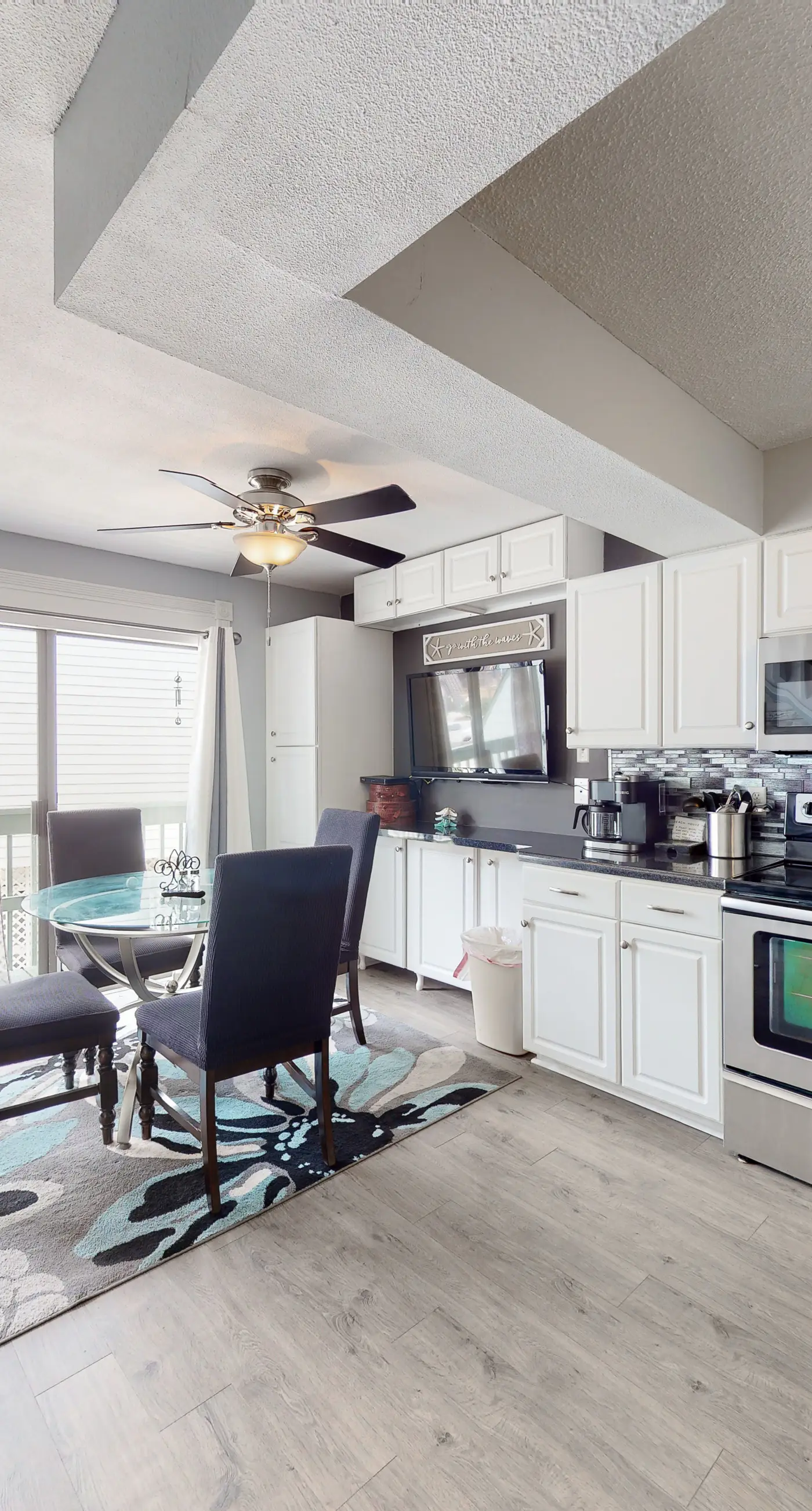 Renovated condo by the beach with pool access & private balconies