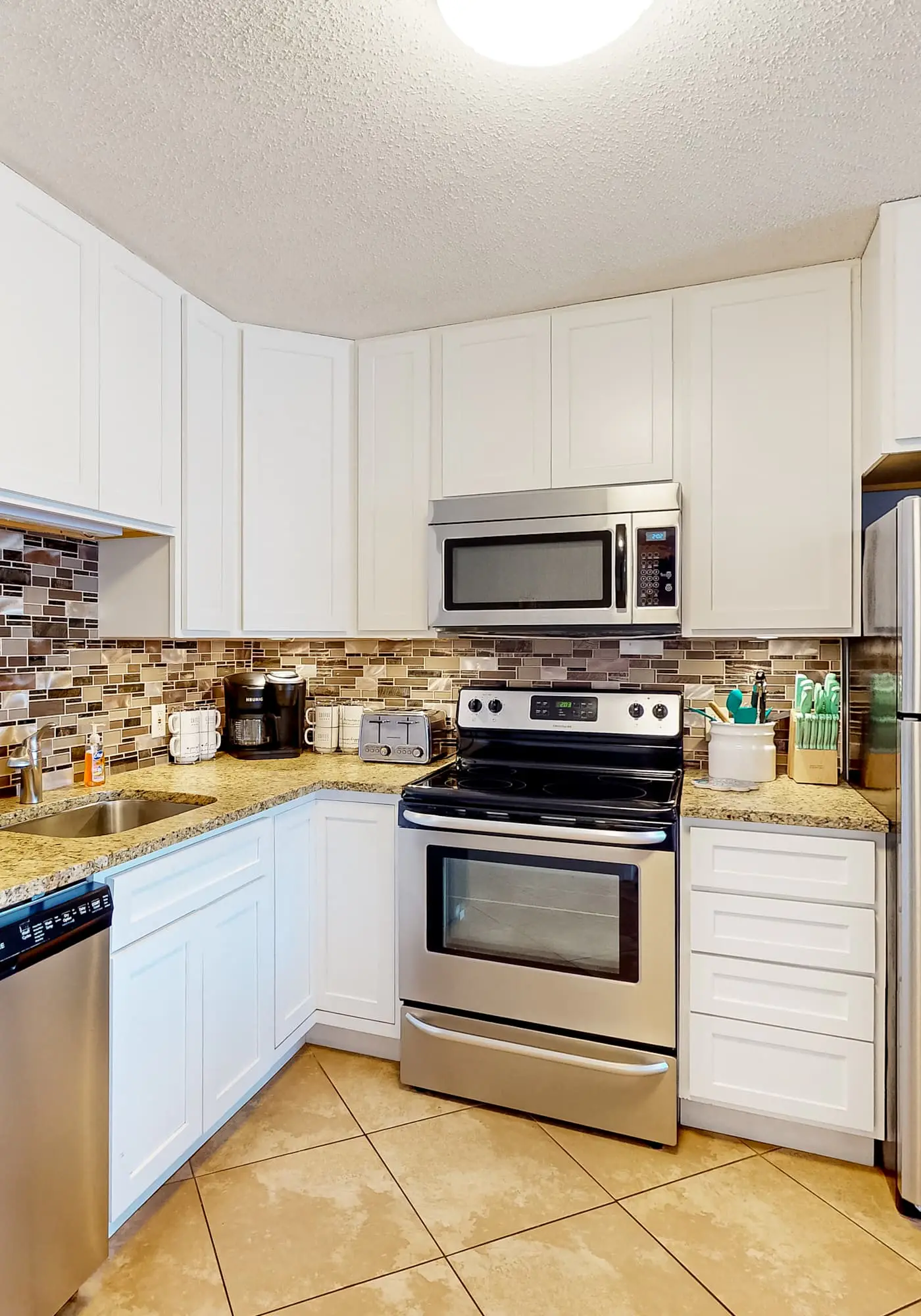 Beachfront condo with 2 pools, Gulf views, hot tub, & cozy balcony