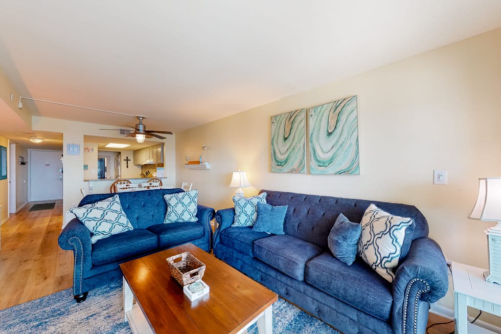 Inviting condo with ocean view, on-site pool, cozy balcony, washer/dryer & AC