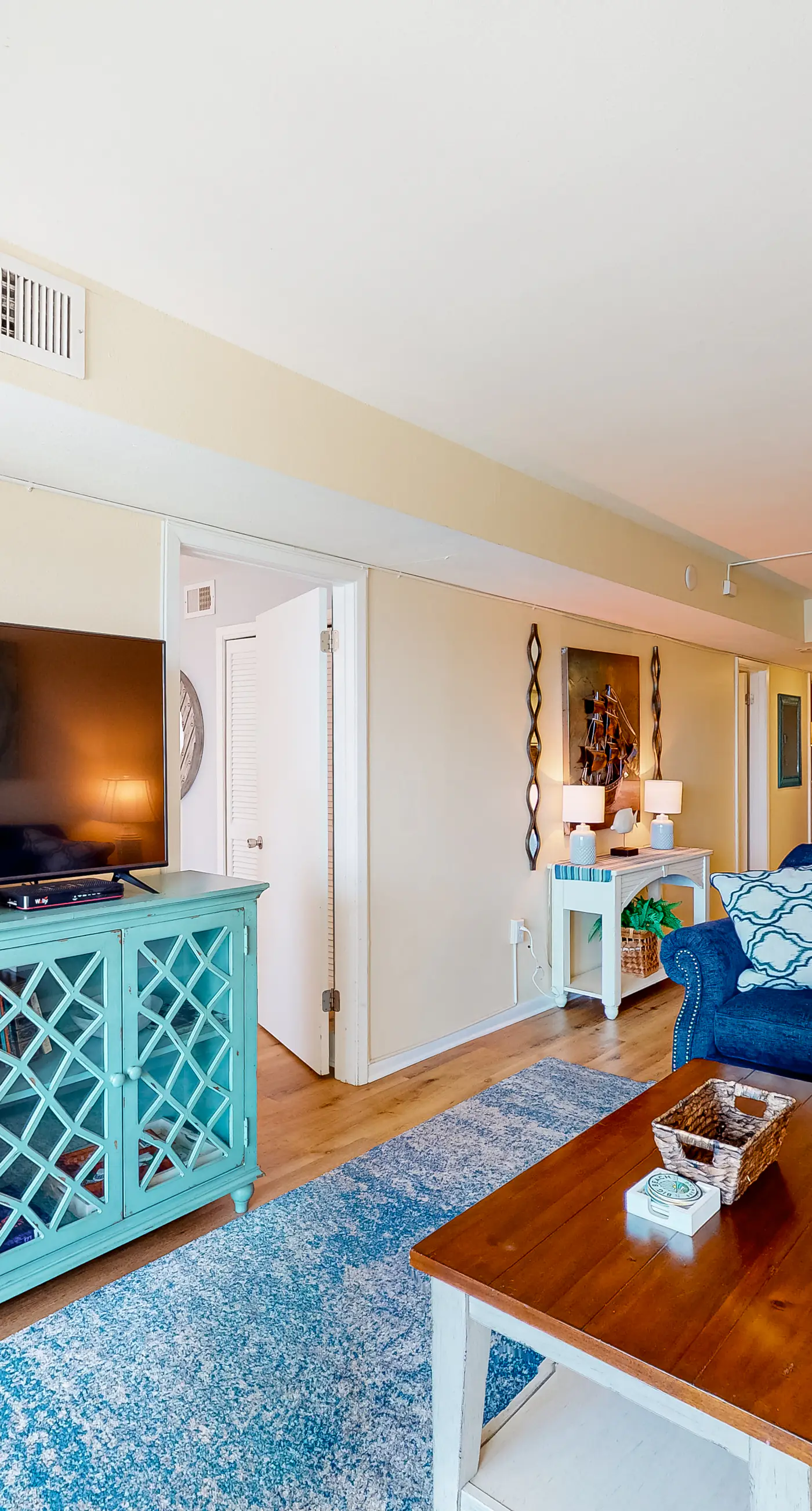 Inviting condo with ocean view, on-site pool, cozy balcony, washer/dryer & AC