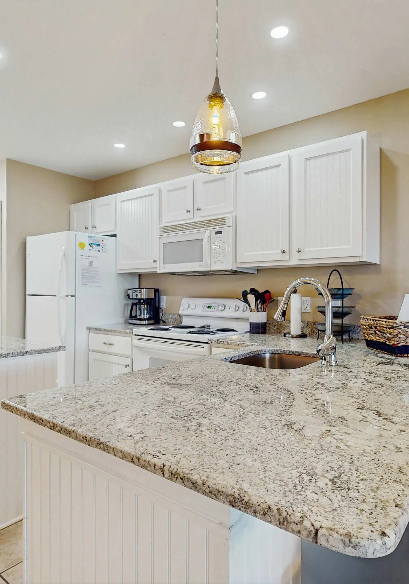 Beach resort condo with patio, central AC, WiFi, on-site pool, & beach access