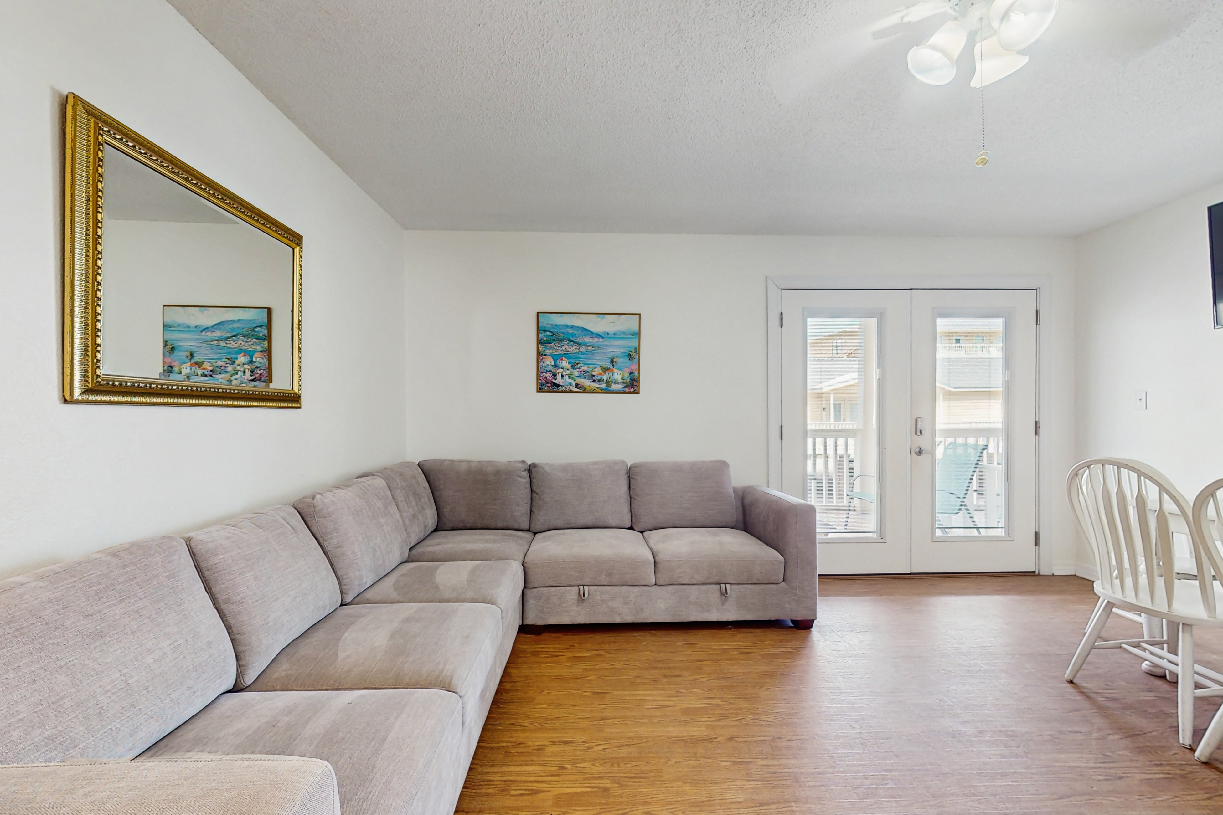 Bright condo near beach with pool access, balcony, & central AC