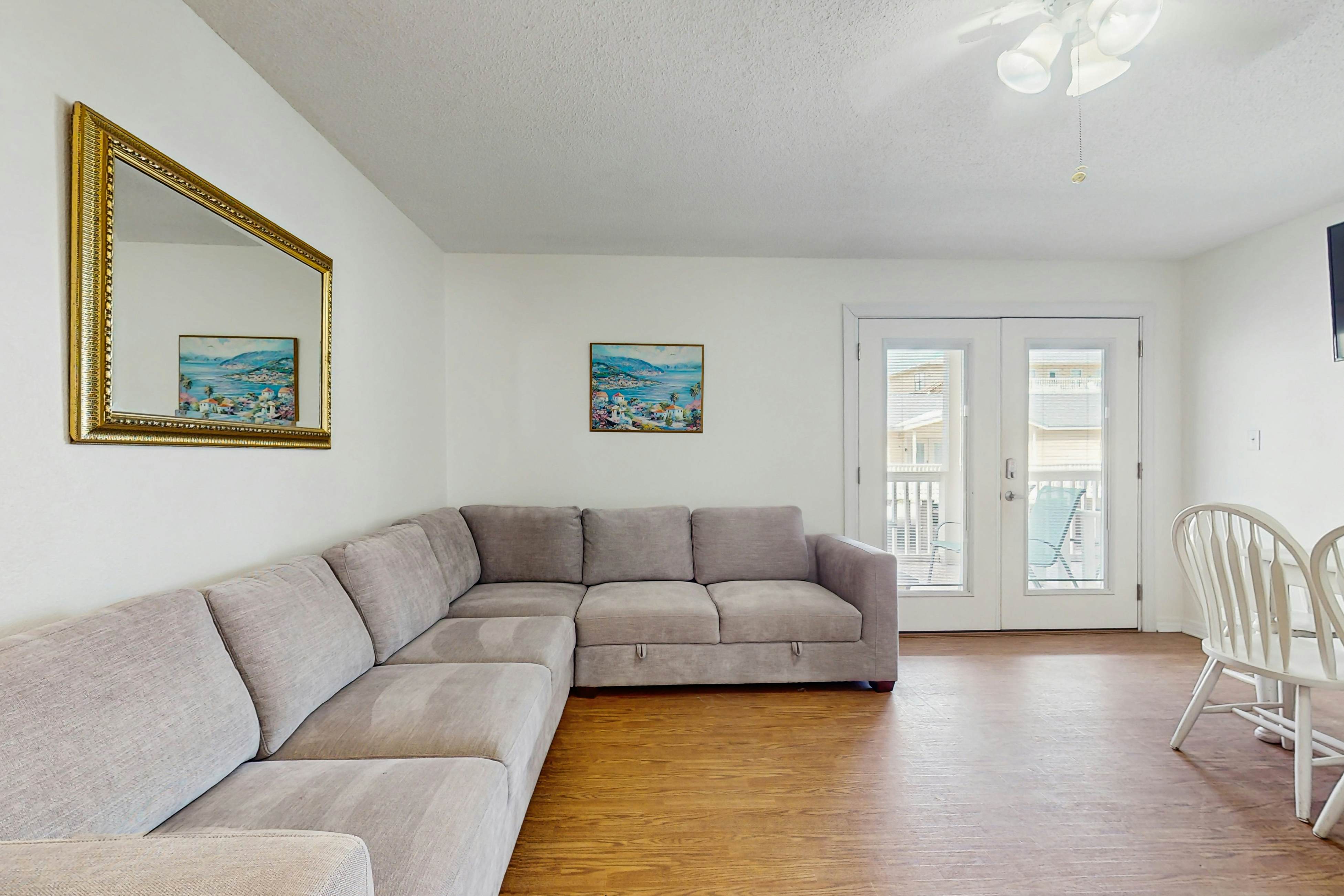 Bright condo near beach with pool access, balcony, & central AC