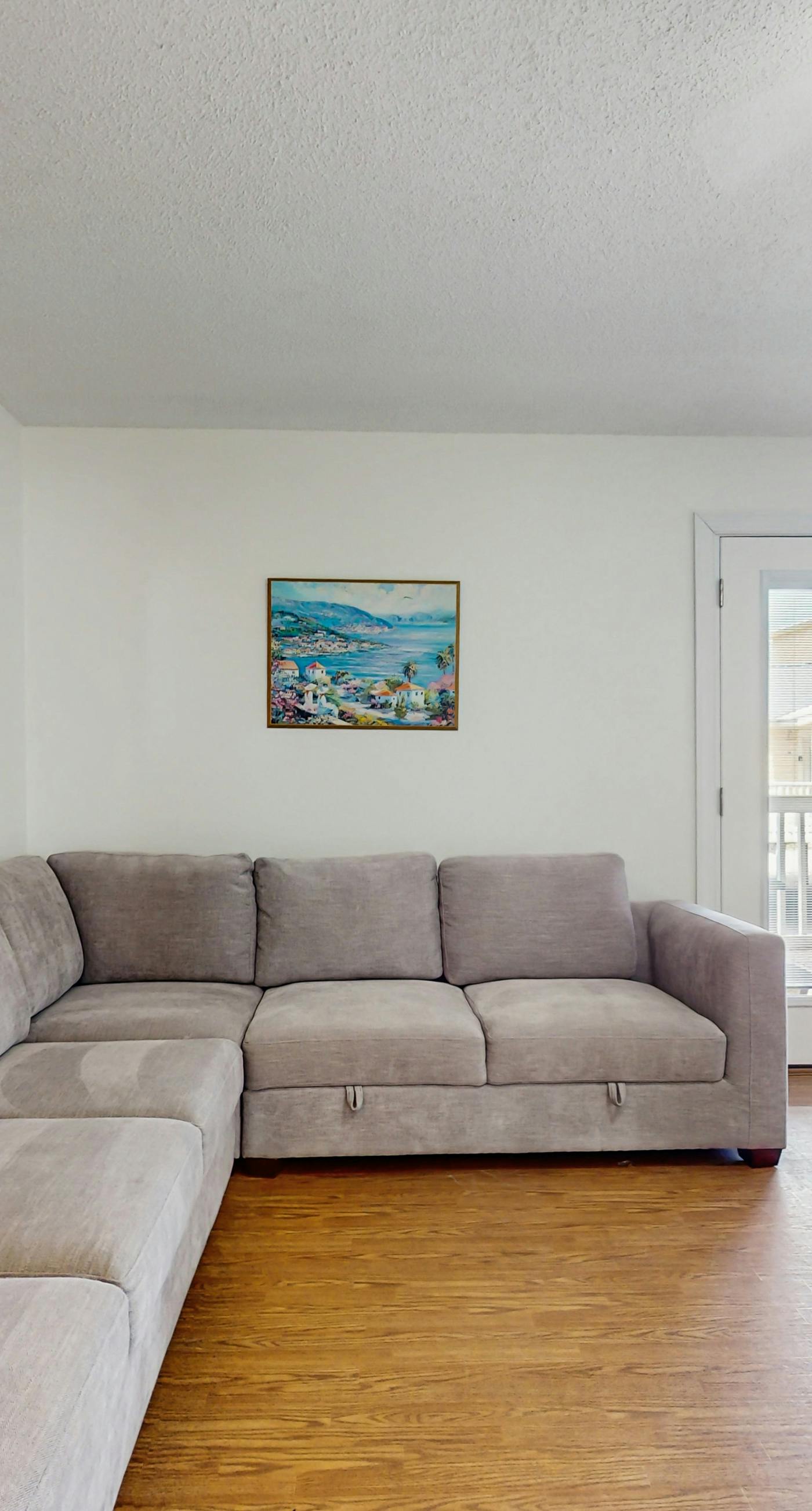 Bright condo near beach with pool access, balcony, & central AC