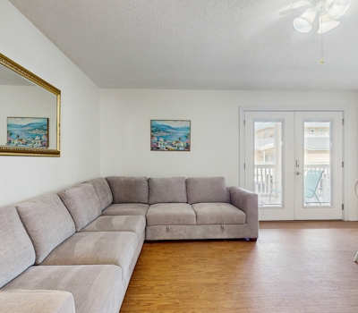 Bright condo near beach with pool access, balcony, & central AC