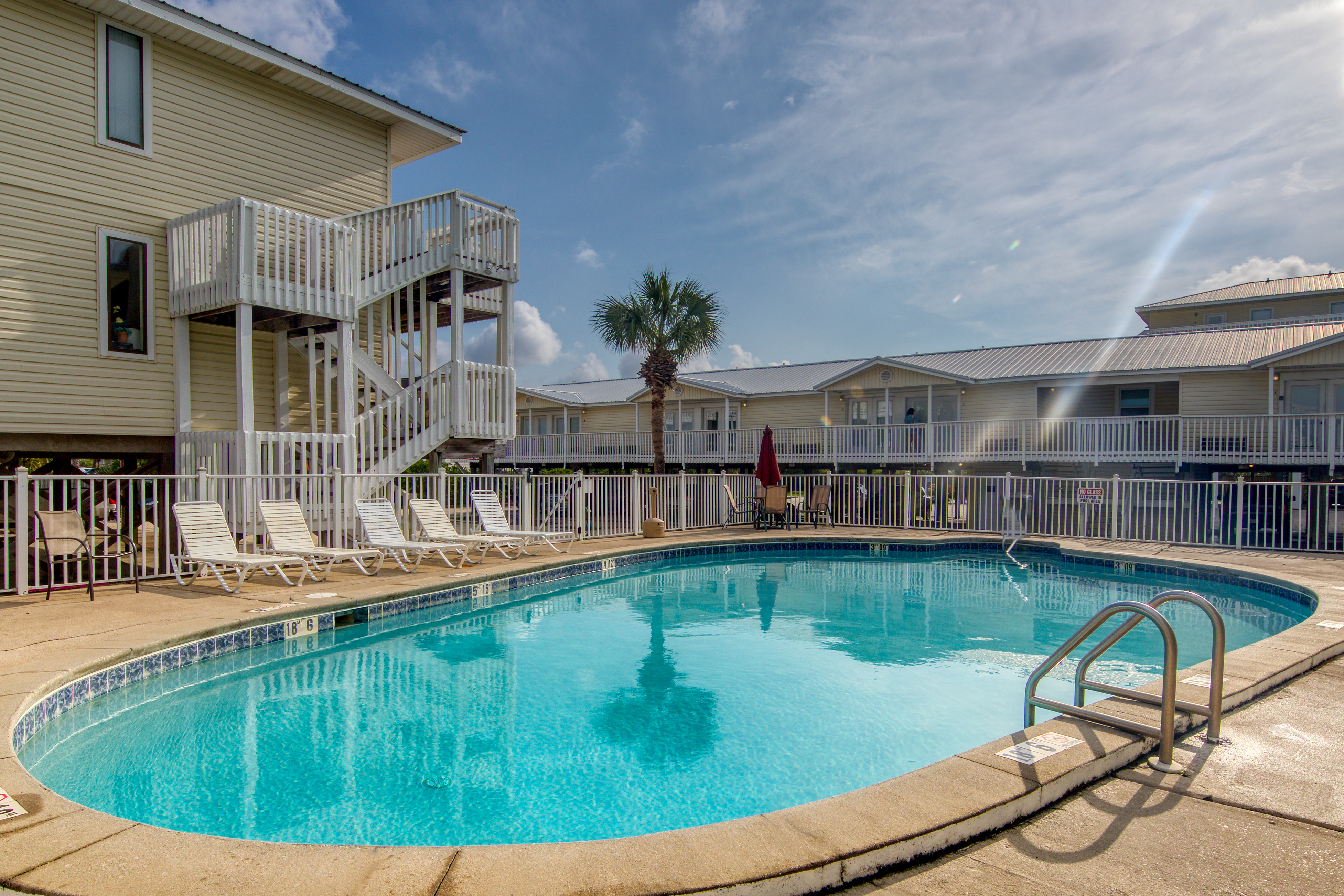 Bright condo near beach with pool access, balcony, & central AC