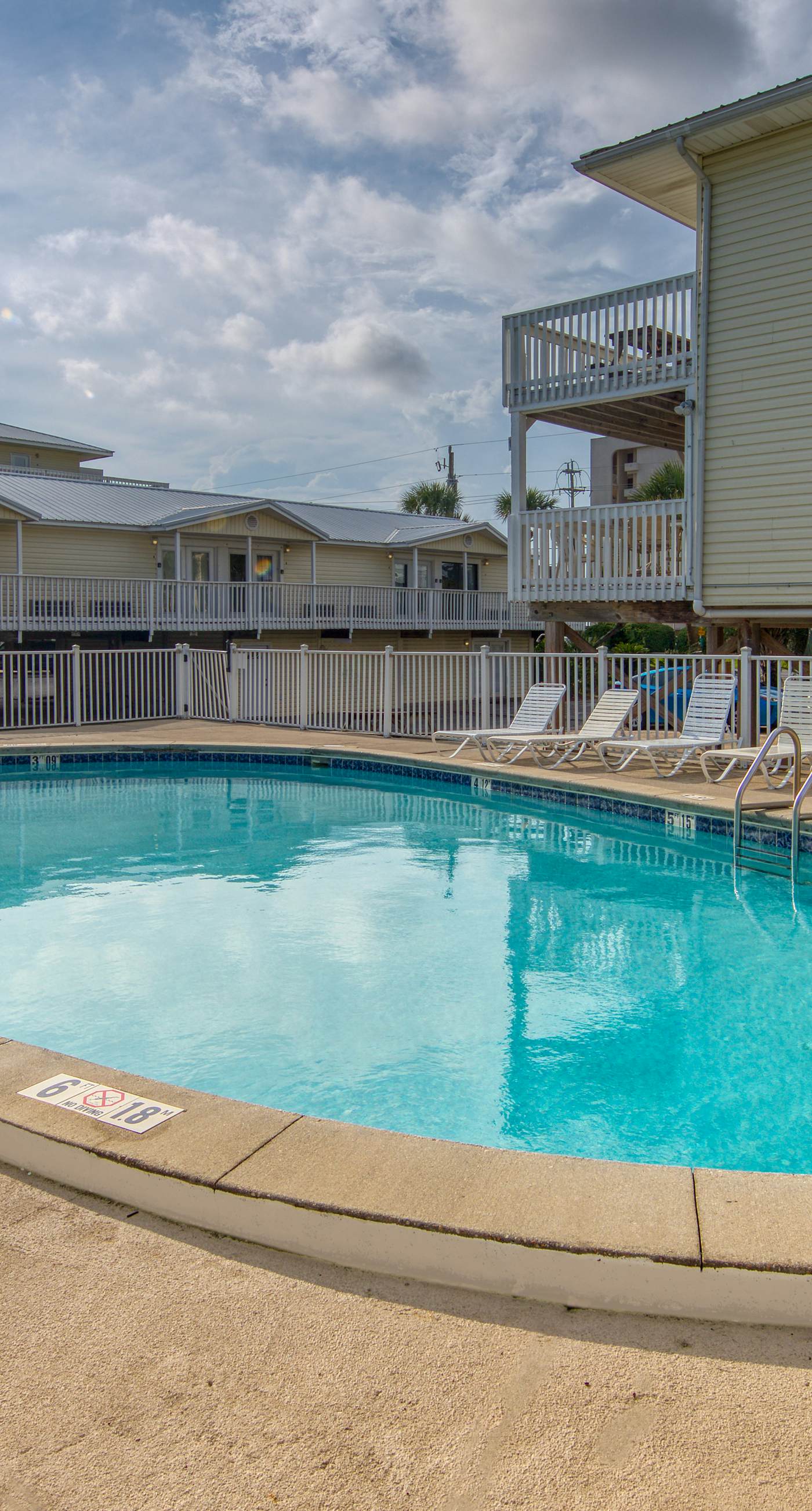 Bright condo near beach with pool access, balcony, & central AC