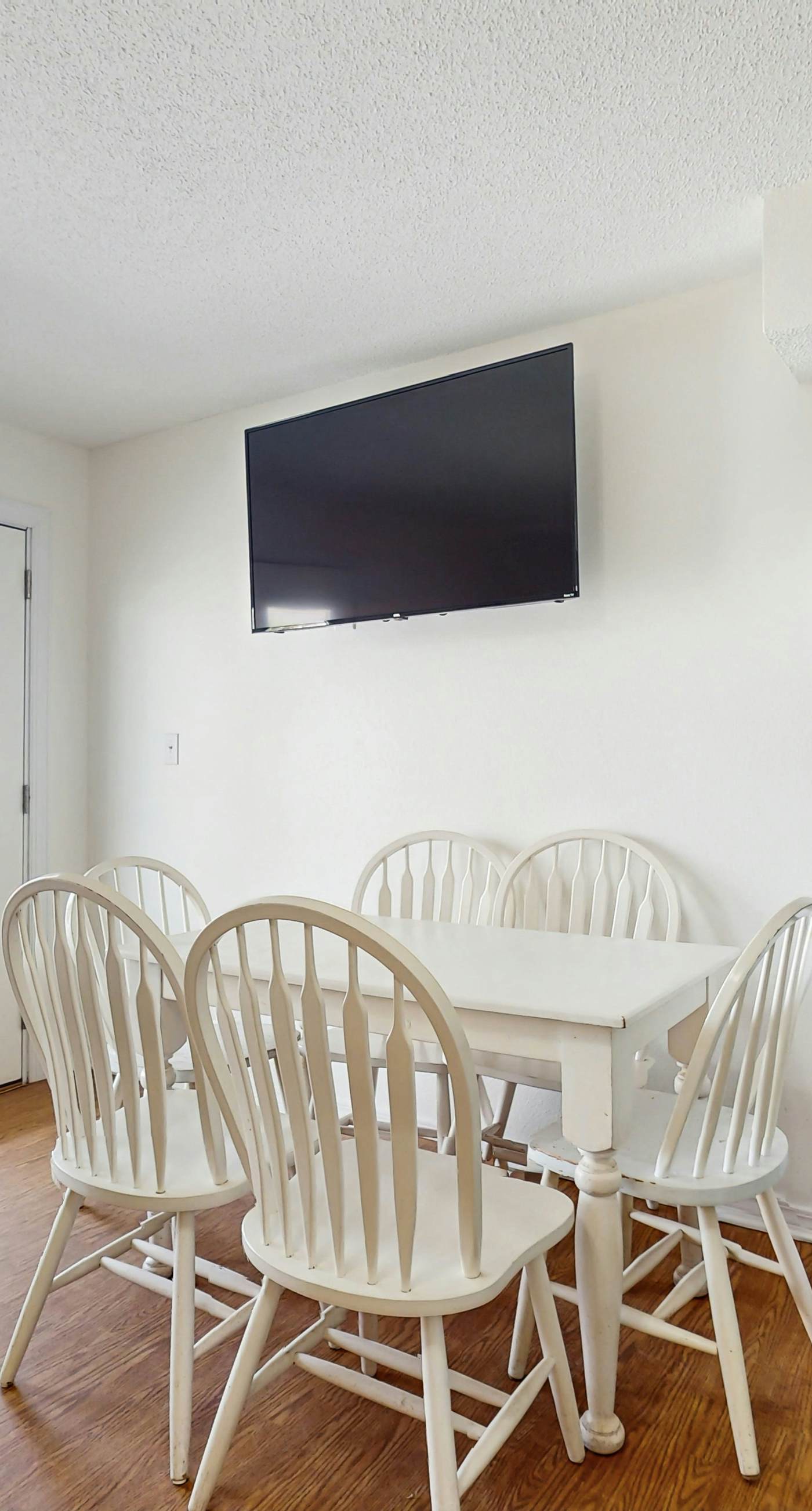 Bright condo near beach with pool access, balcony, & central AC