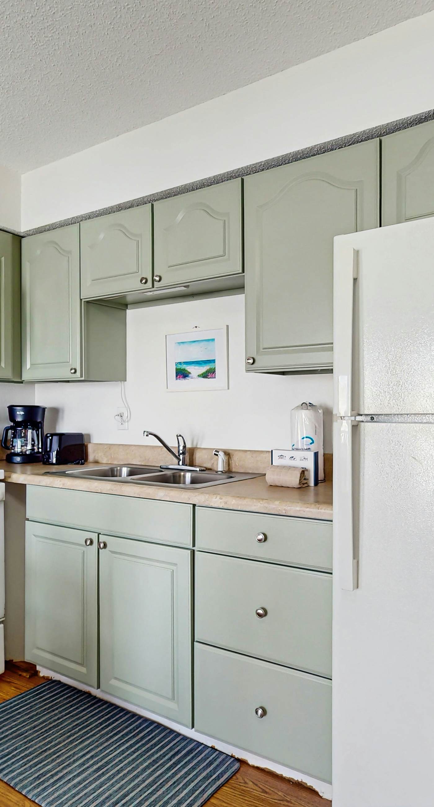 Bright condo near beach with pool access, balcony, & central AC