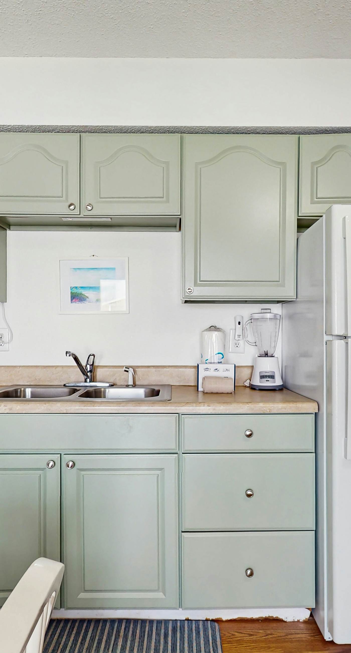 Bright condo near beach with pool access, balcony, & central AC