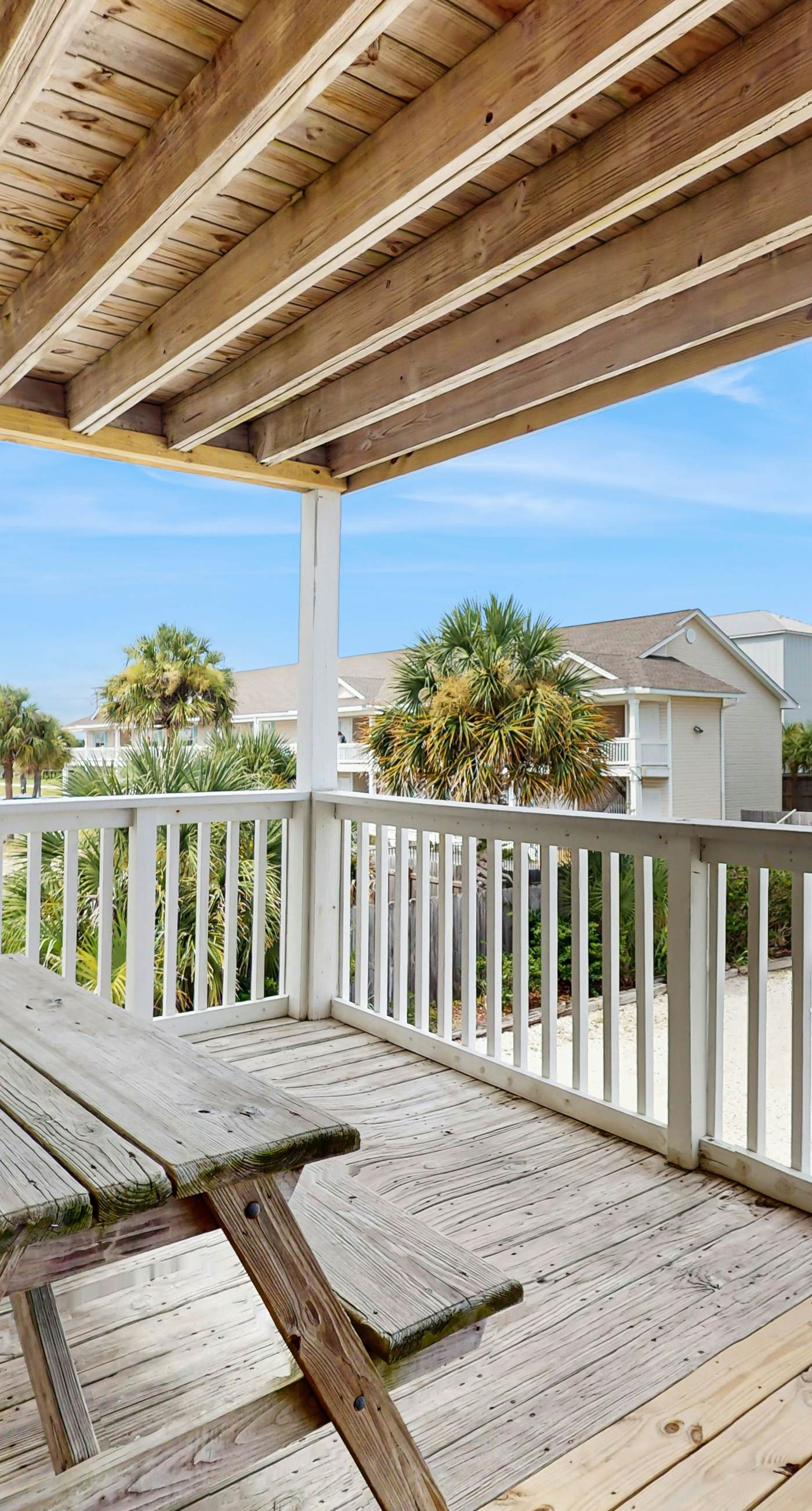 Bright condo near beach with pool access, balcony, & central AC