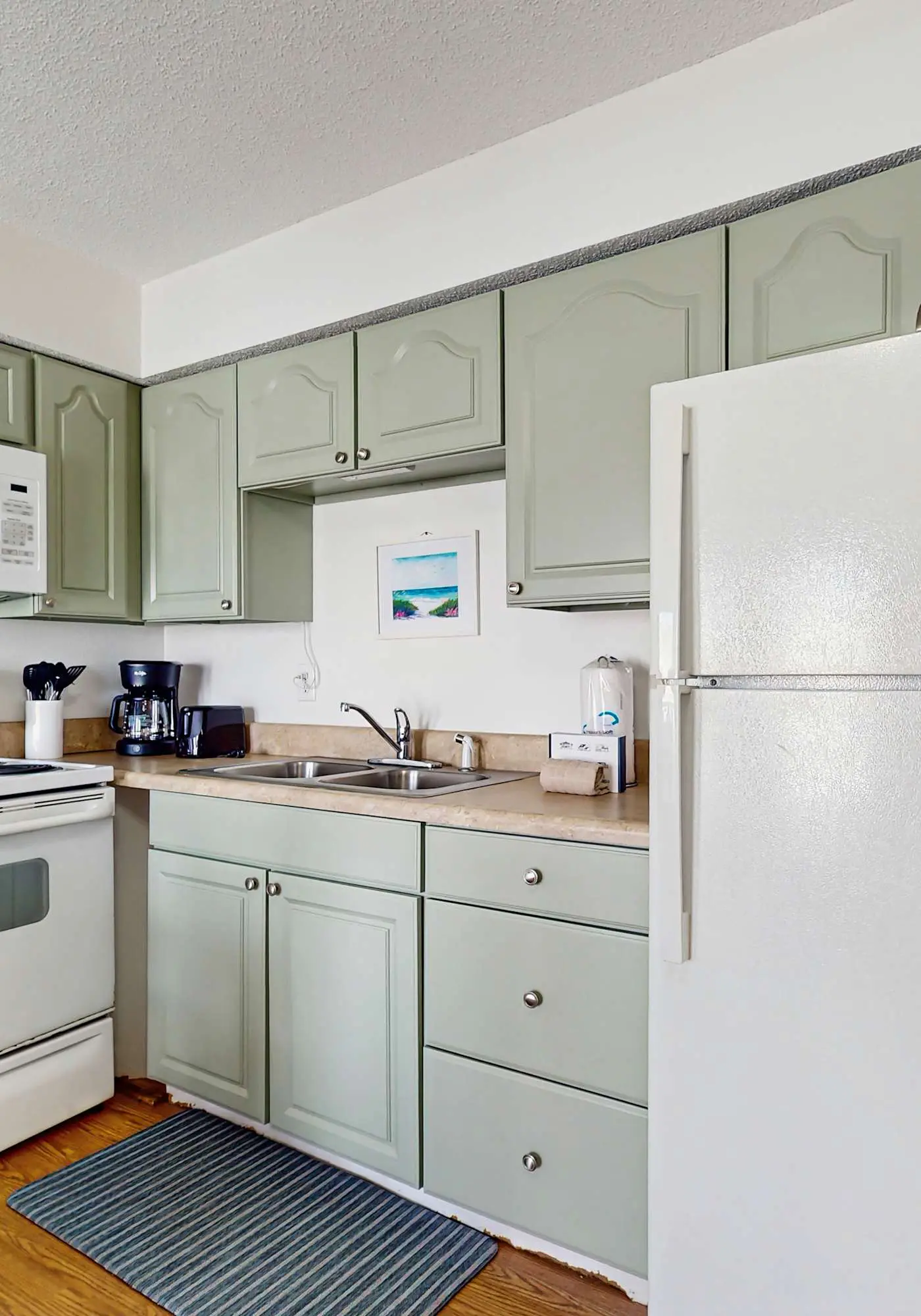 Bright condo near beach with pool access, balcony, & central AC