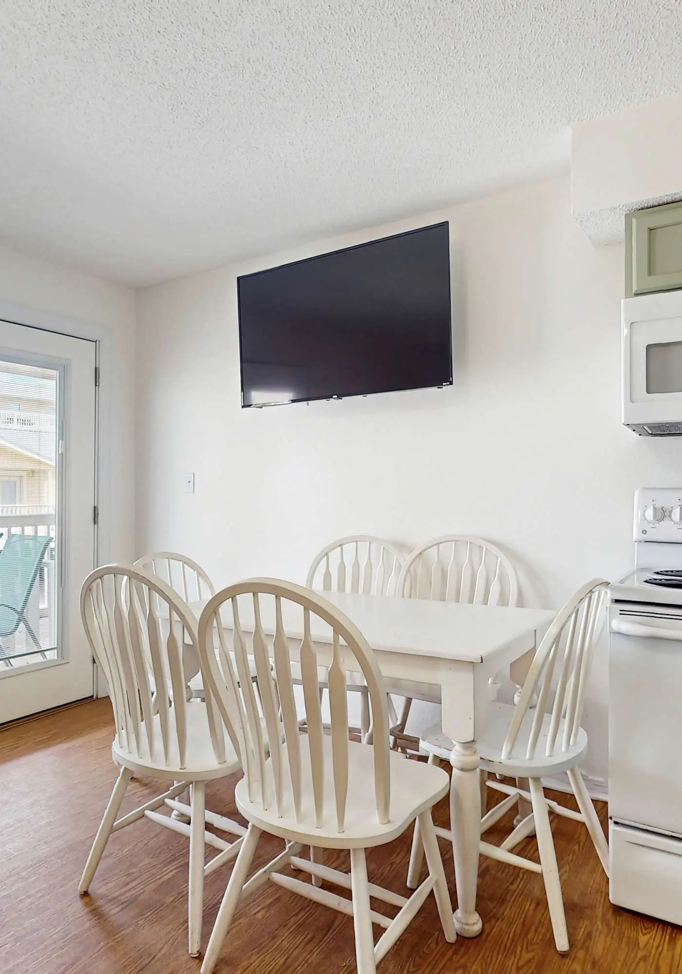 Bright condo near beach with pool access, balcony, & central AC