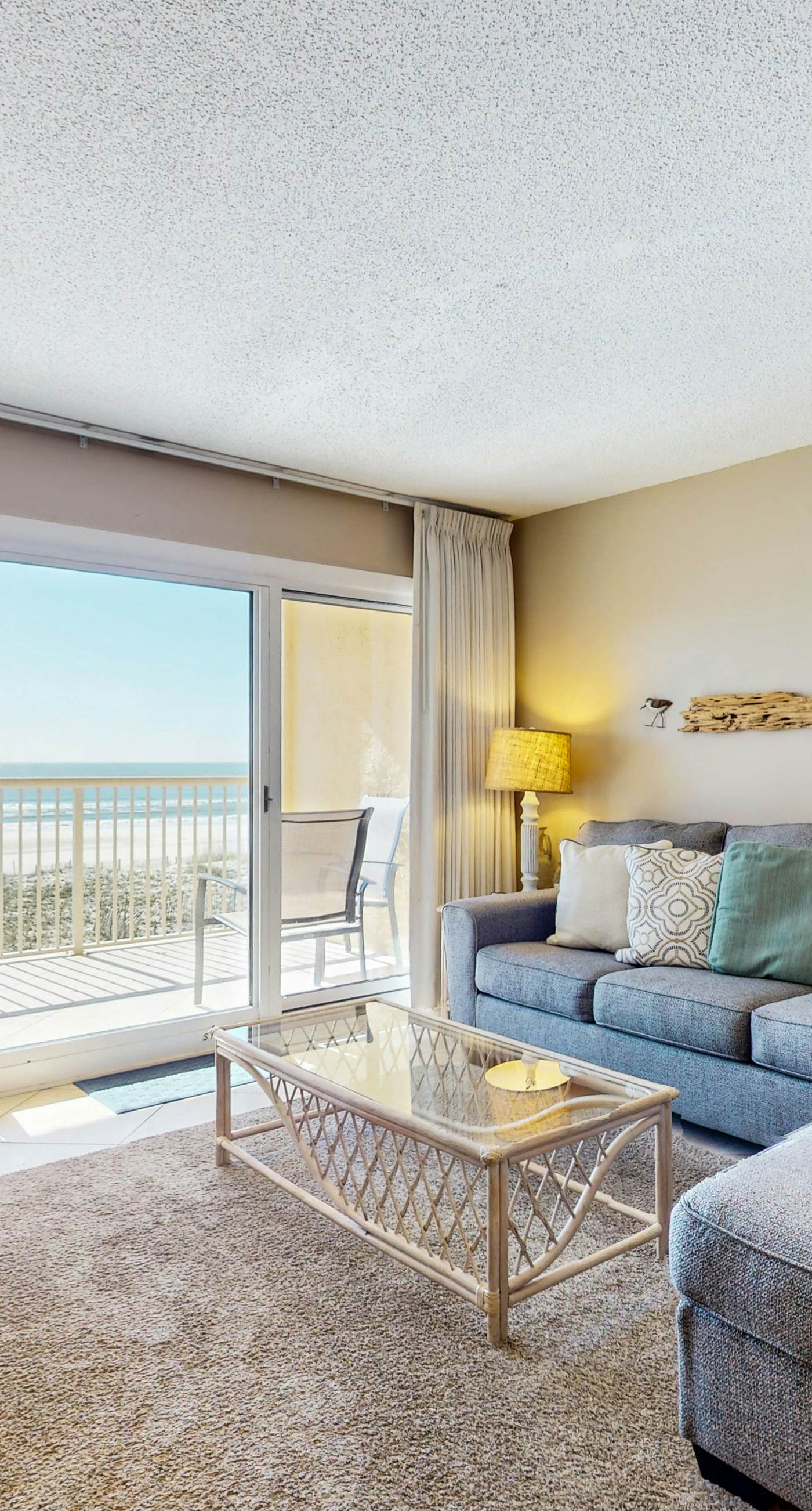 2nd-floor beachfront condo with Gulf views, balcony, outdoor pool, W/D, elevator