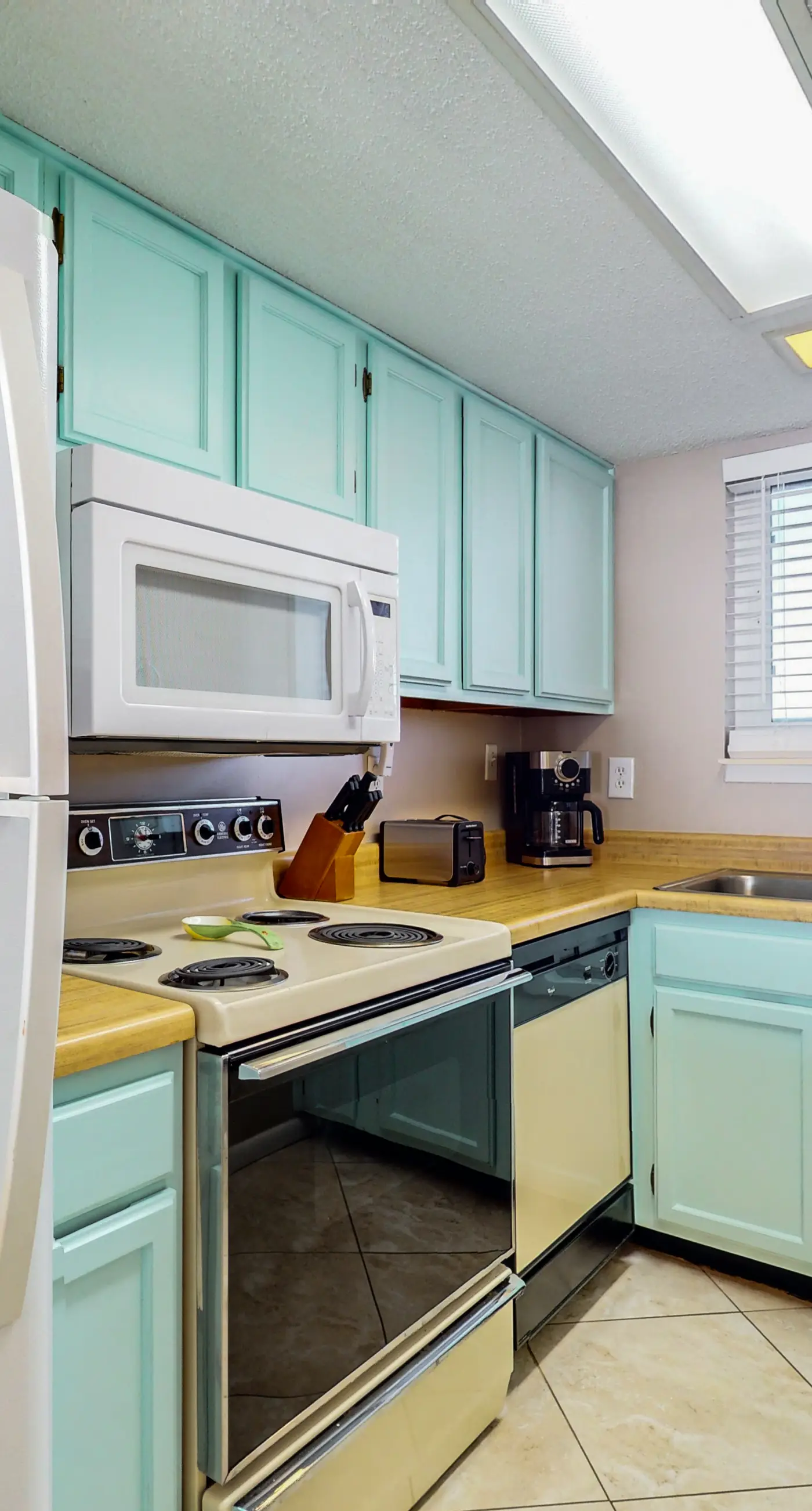 2nd-floor beachfront condo with Gulf views, balcony, outdoor pool, W/D, elevator