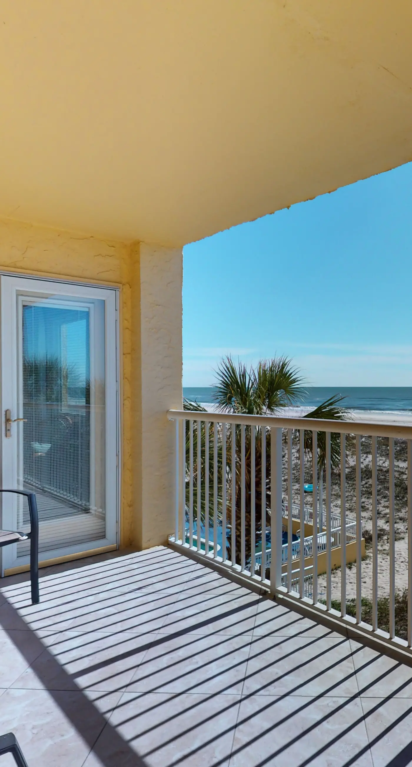 2nd-floor beachfront condo with Gulf views, balcony, outdoor pool, W/D, elevator