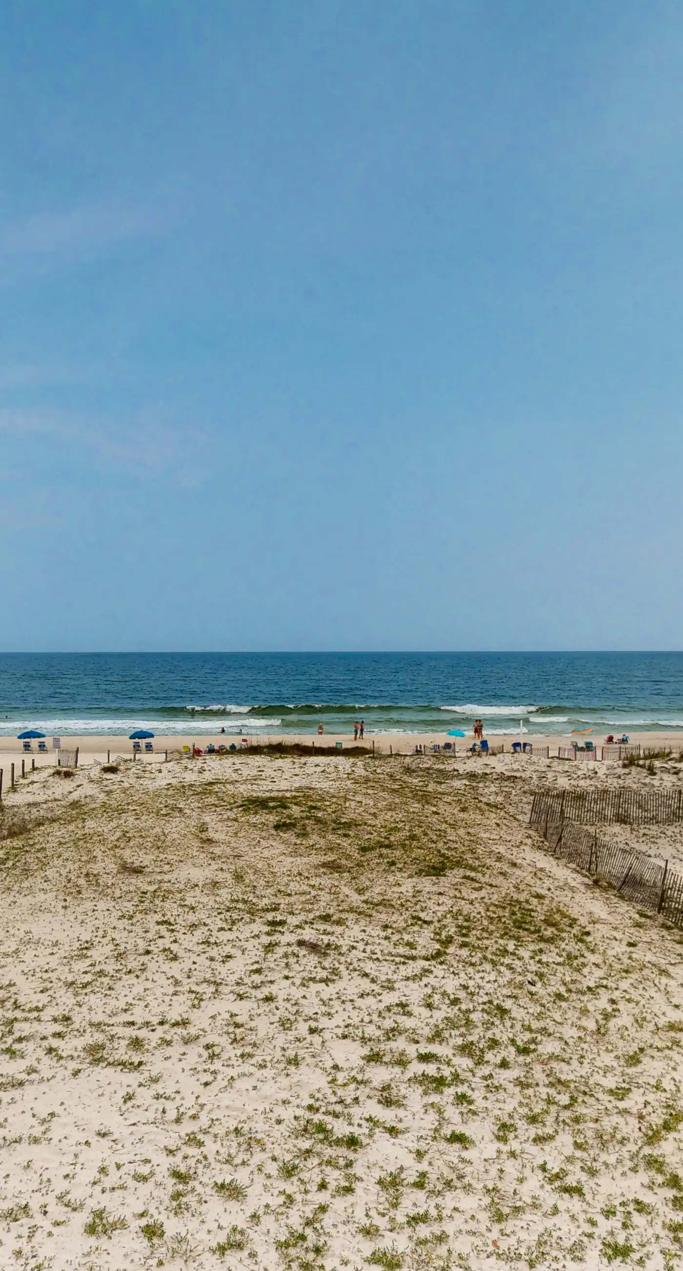 2nd-floor beachfront condo with Gulf views, balcony, outdoor pool, W/D, elevator