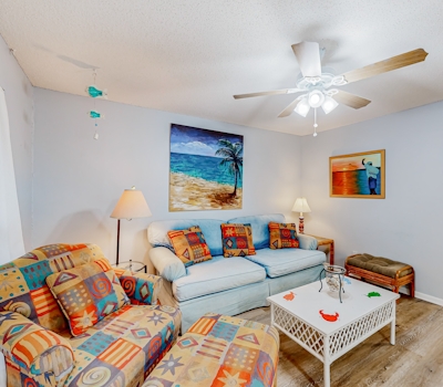 Perfectly located waterfront condo with AC & W/D - steps away from sandy beaches