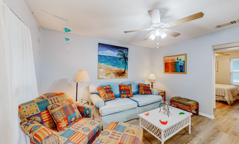 Perfectly located waterfront condo with AC & W/D - steps away from sandy beaches