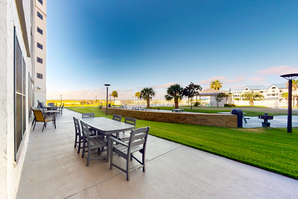 Gulf-front ground floor condo with beach access, pools, hot tub, & sports courts