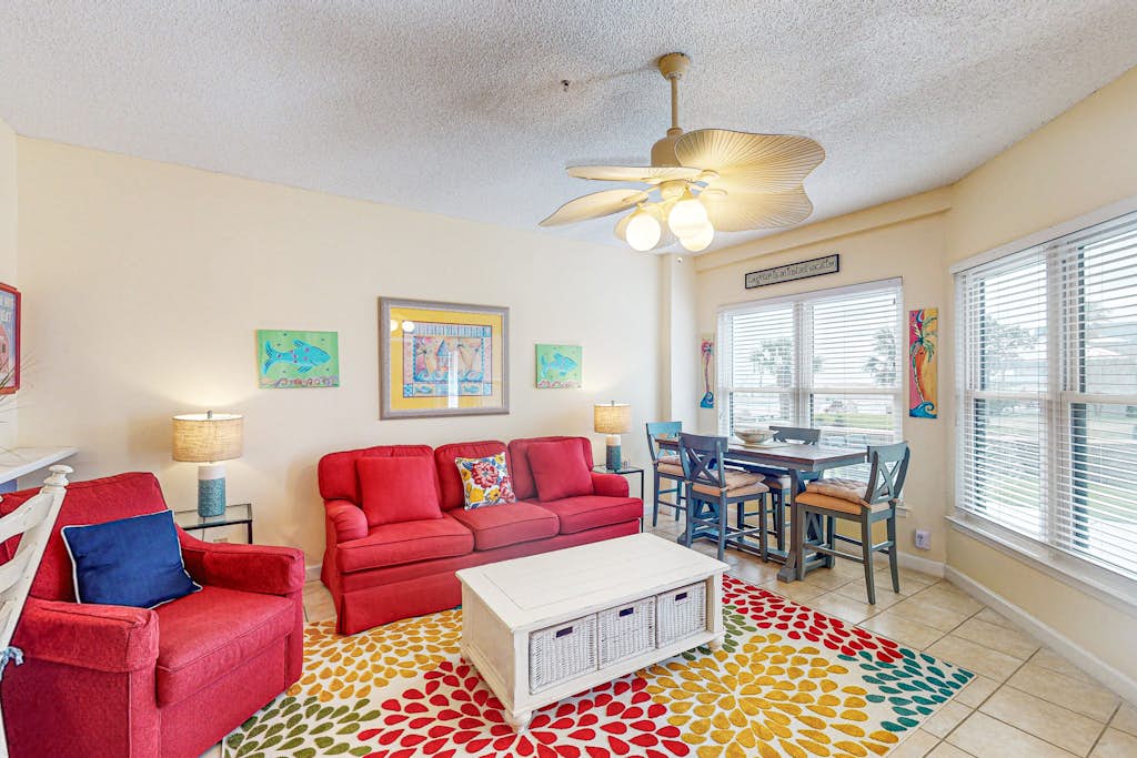 Gulf-front ground floor condo with beach access, pools, hot tub, & sports courts