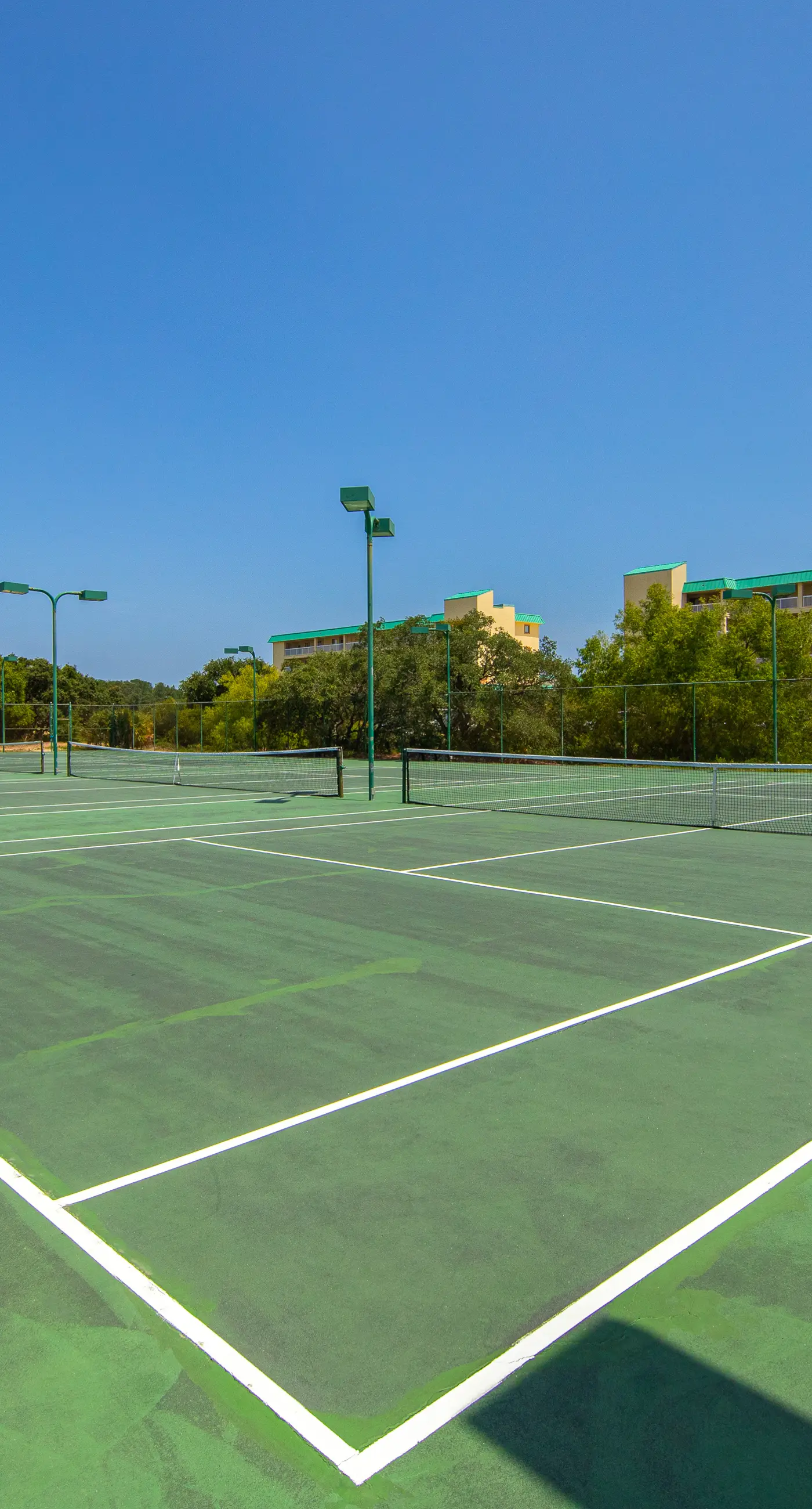 Gulf-front condo with beach access, pools, hot tub, & sports courts