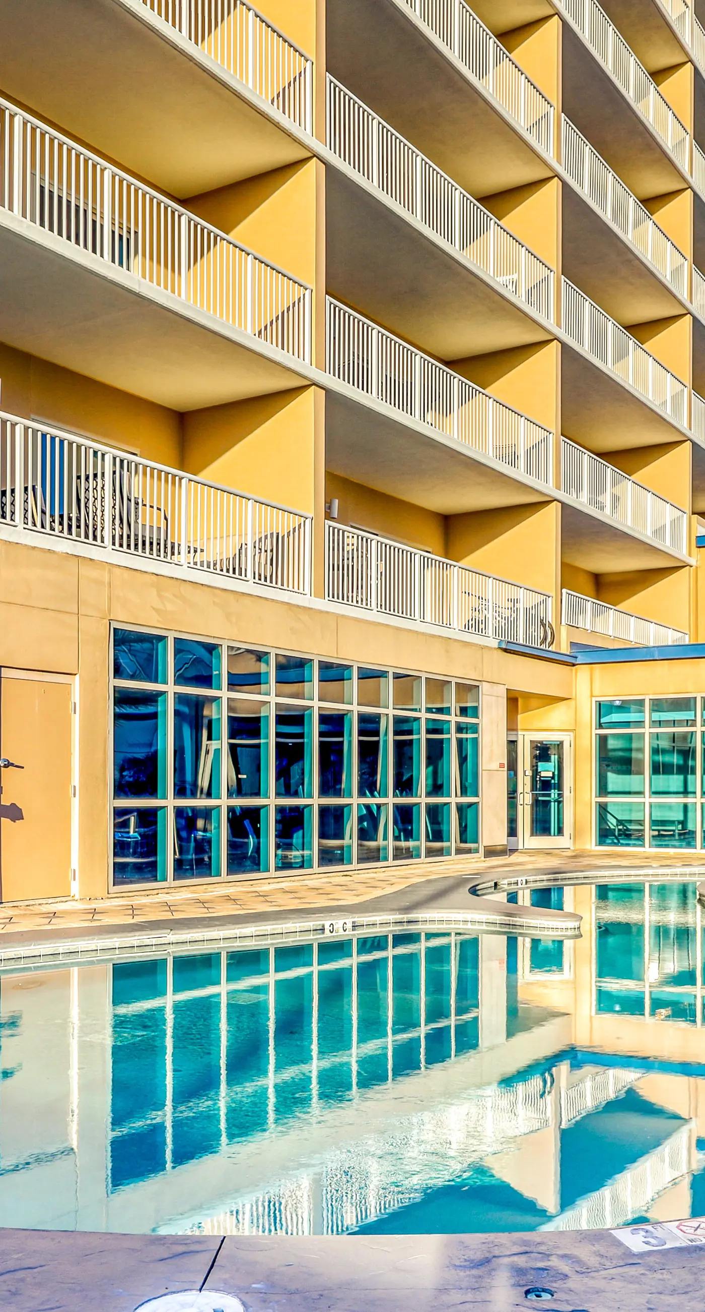 Gulf view condo with resort amenities, scenic balcony, open layout, W&D, & AC