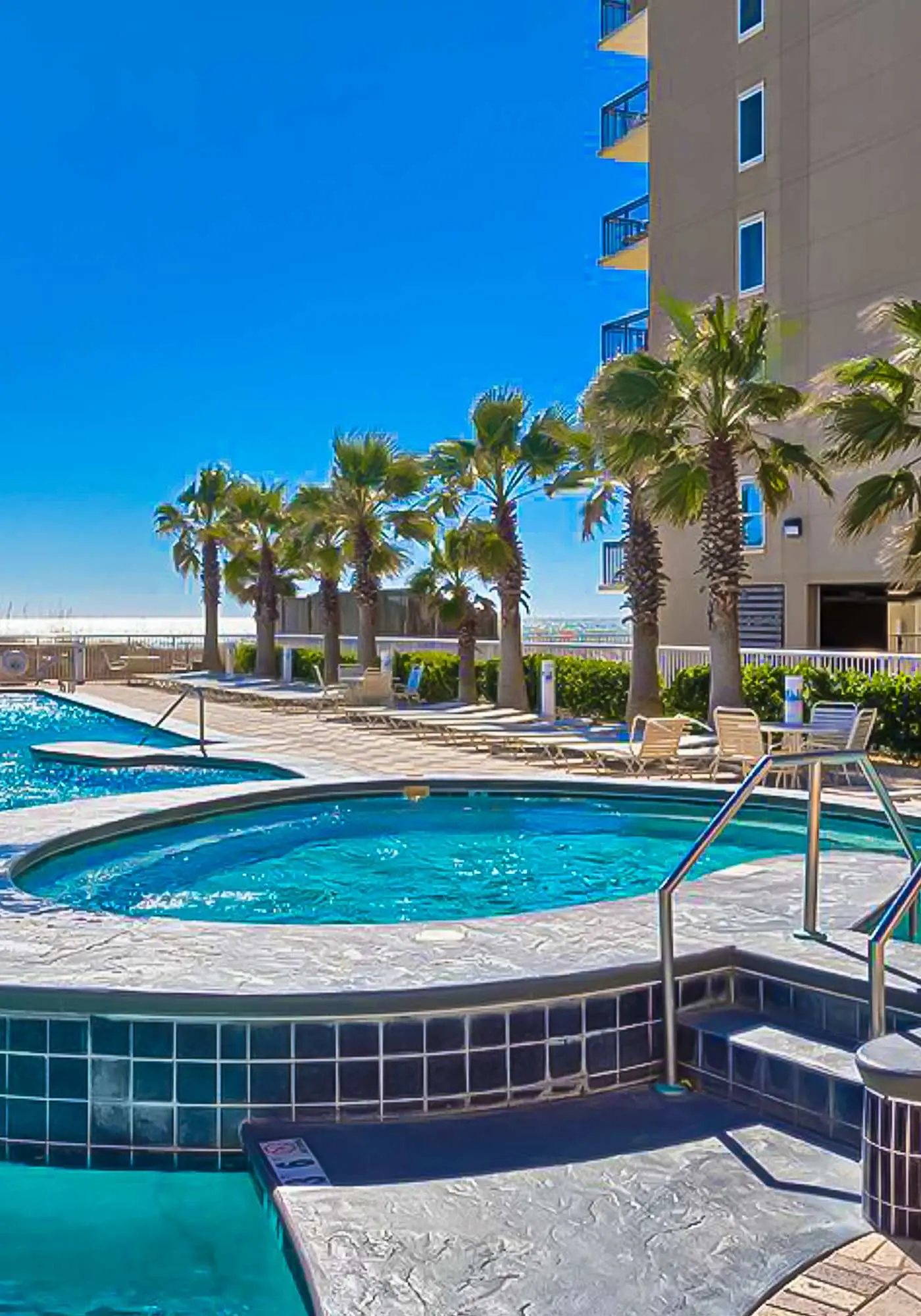 Gulf view condo on top floor with pools, hot tubs, saunas, gym & beach access