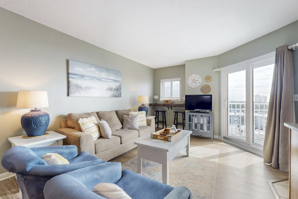 Bright coastal condo with Gulf views, pools, hot tub & private balcony