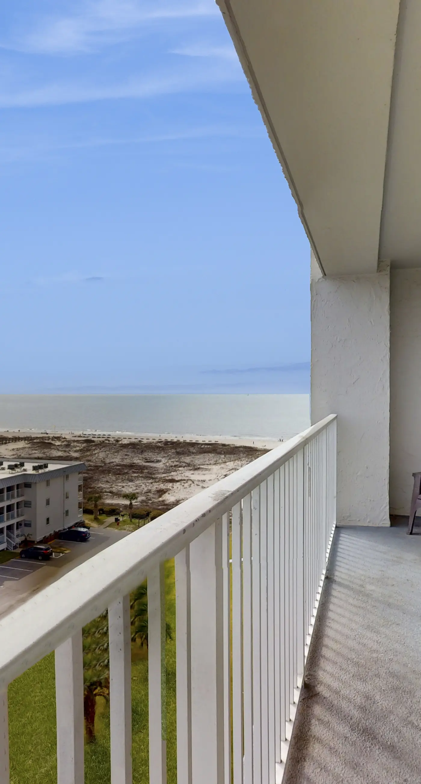 Bright coastal condo with Gulf views, pools, hot tub & private balcony