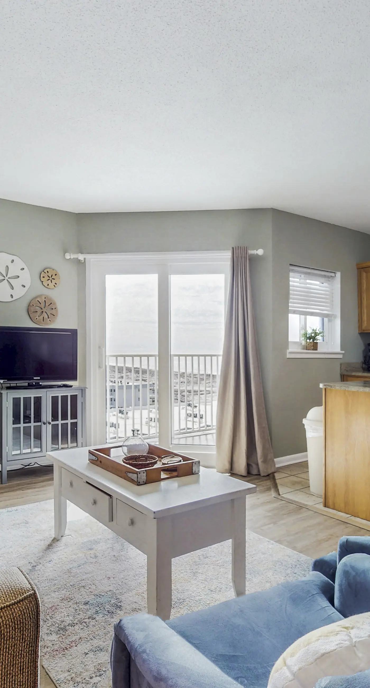 Bright coastal condo with Gulf views, pools, hot tub & private balcony