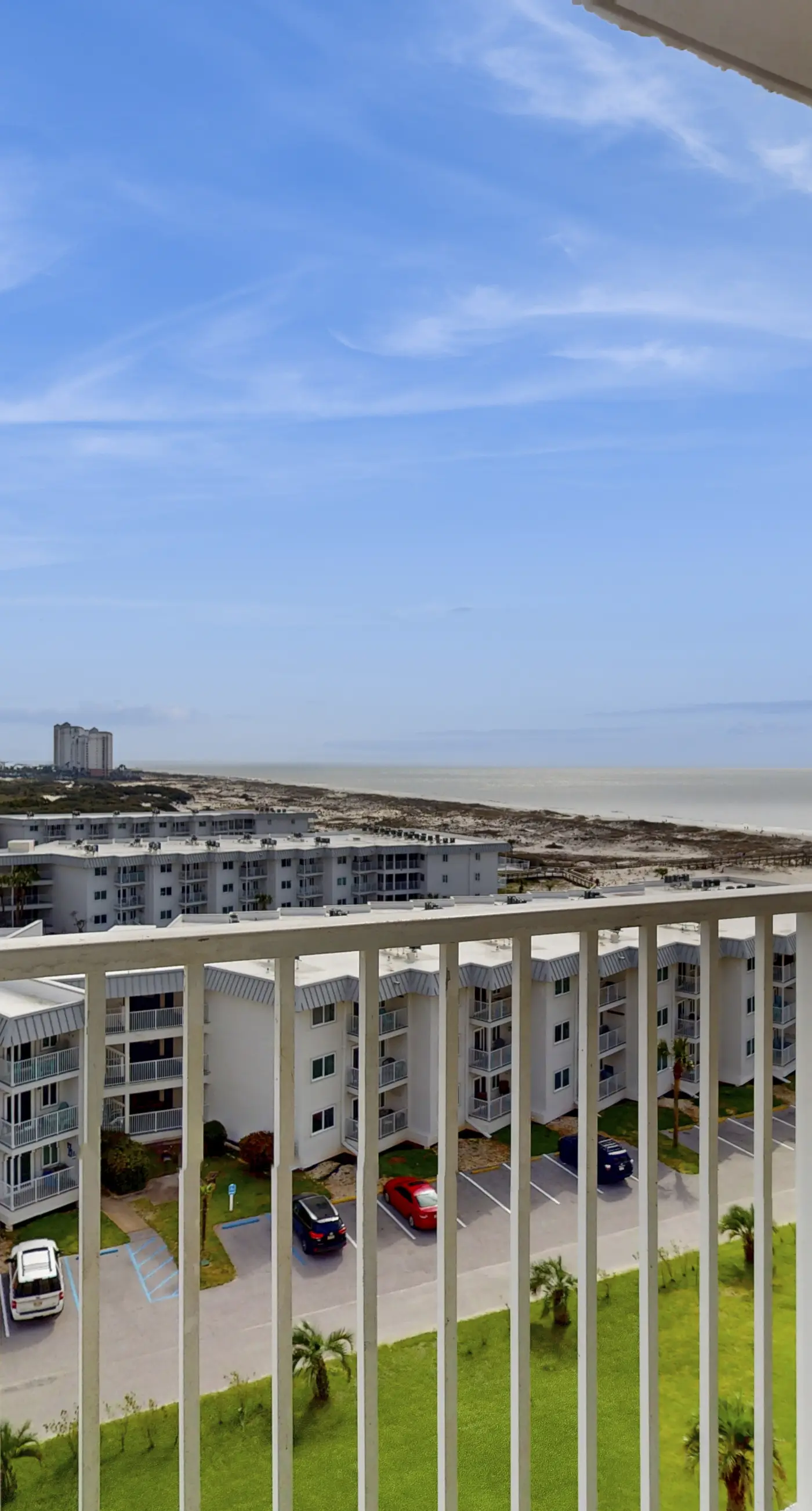 Bright coastal condo with Gulf views, pools, hot tub & private balcony