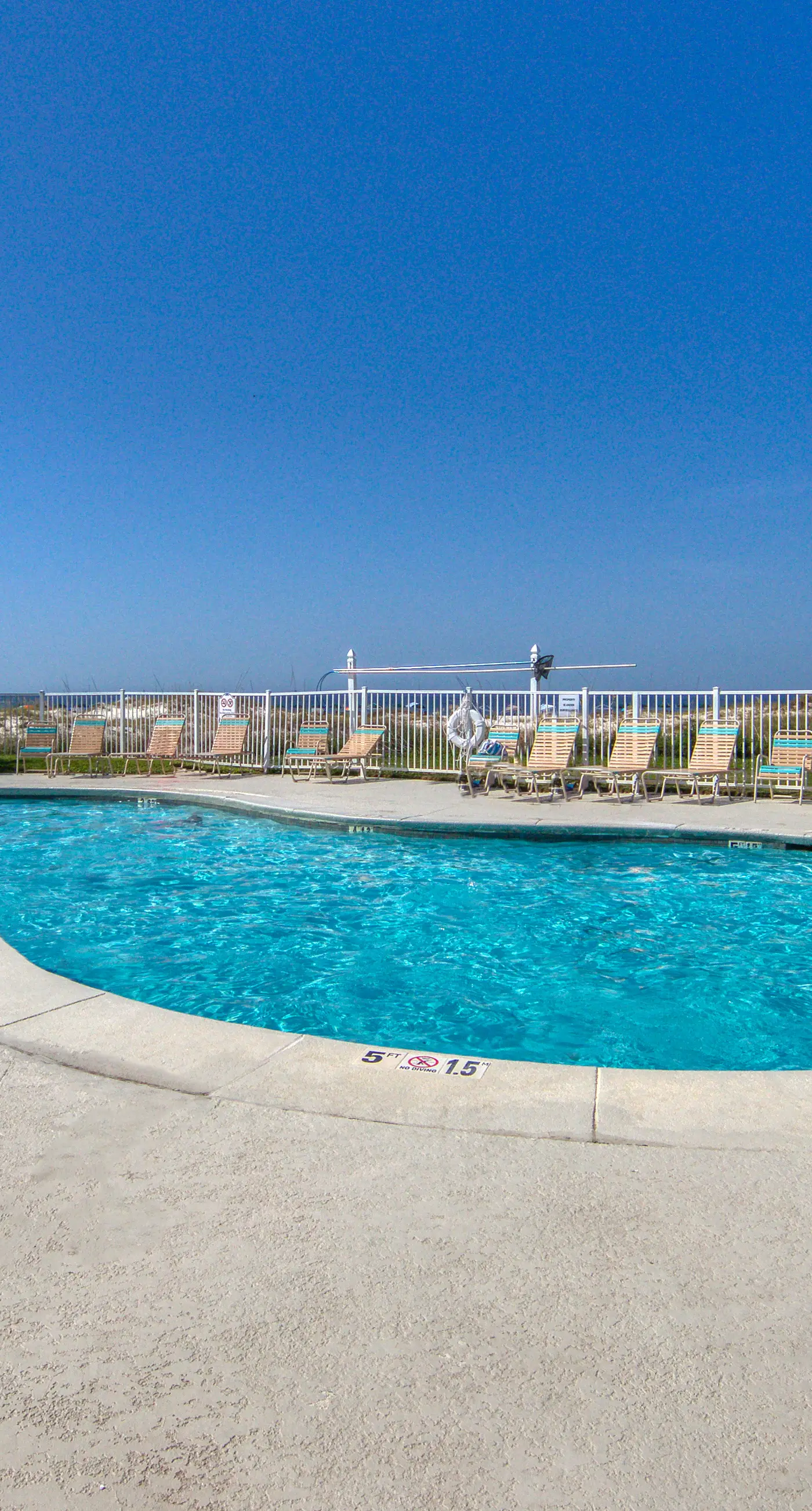 Bright coastal condo with Gulf views, pools, hot tub & private balcony