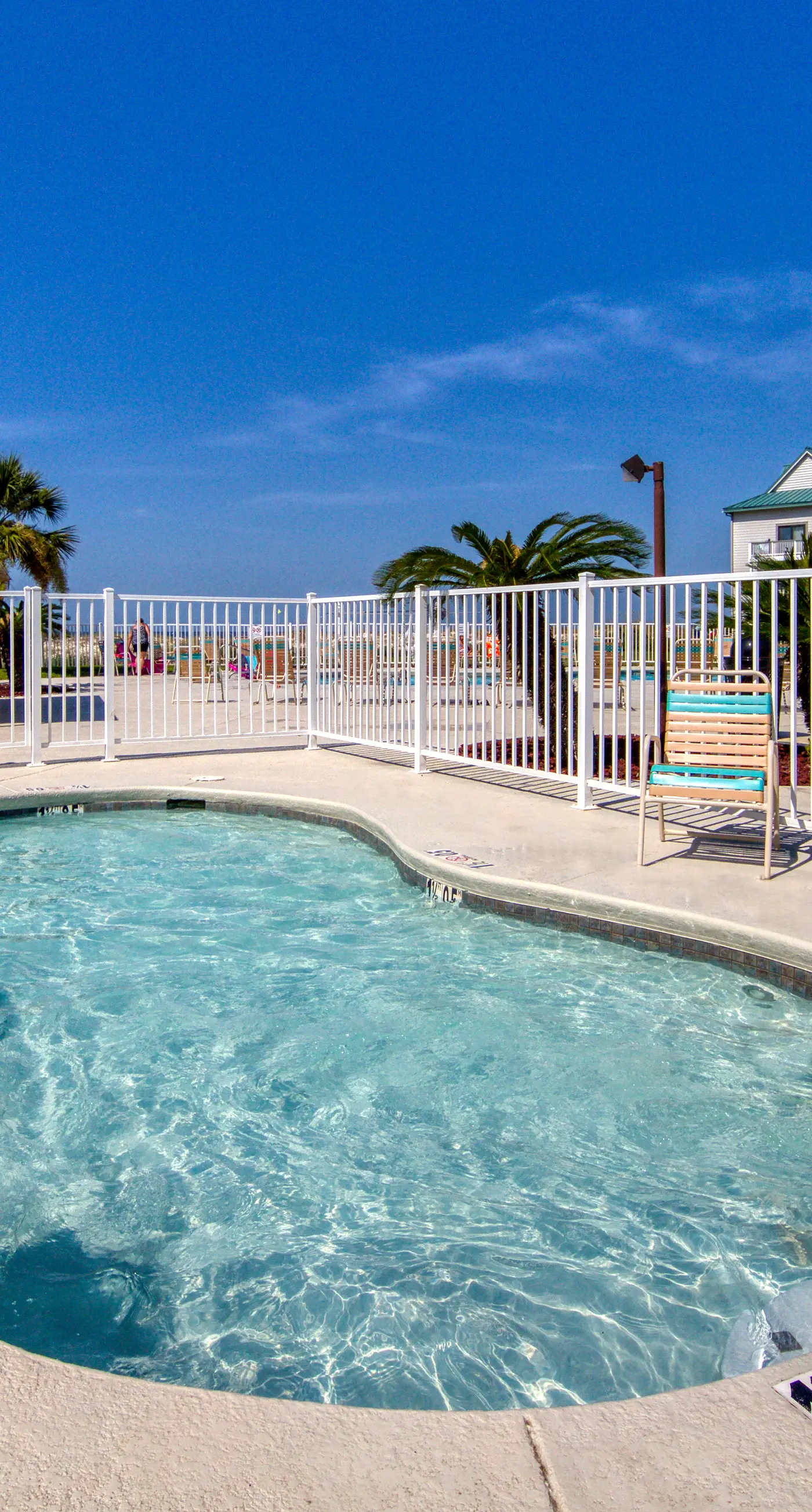 Bright coastal condo with Gulf views, pools, hot tub & private balcony