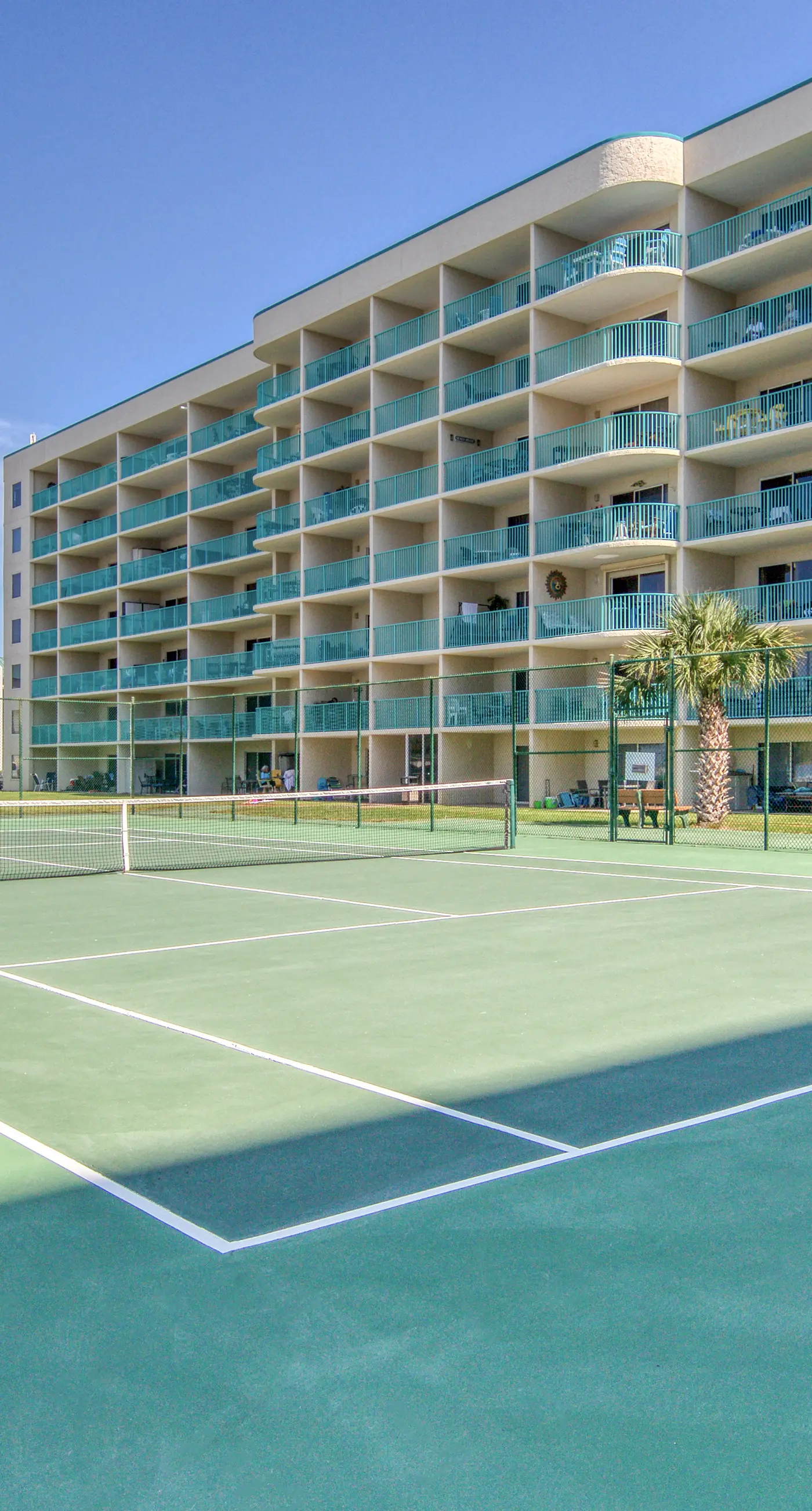 Bright coastal condo with Gulf views, pools, hot tub & private balcony