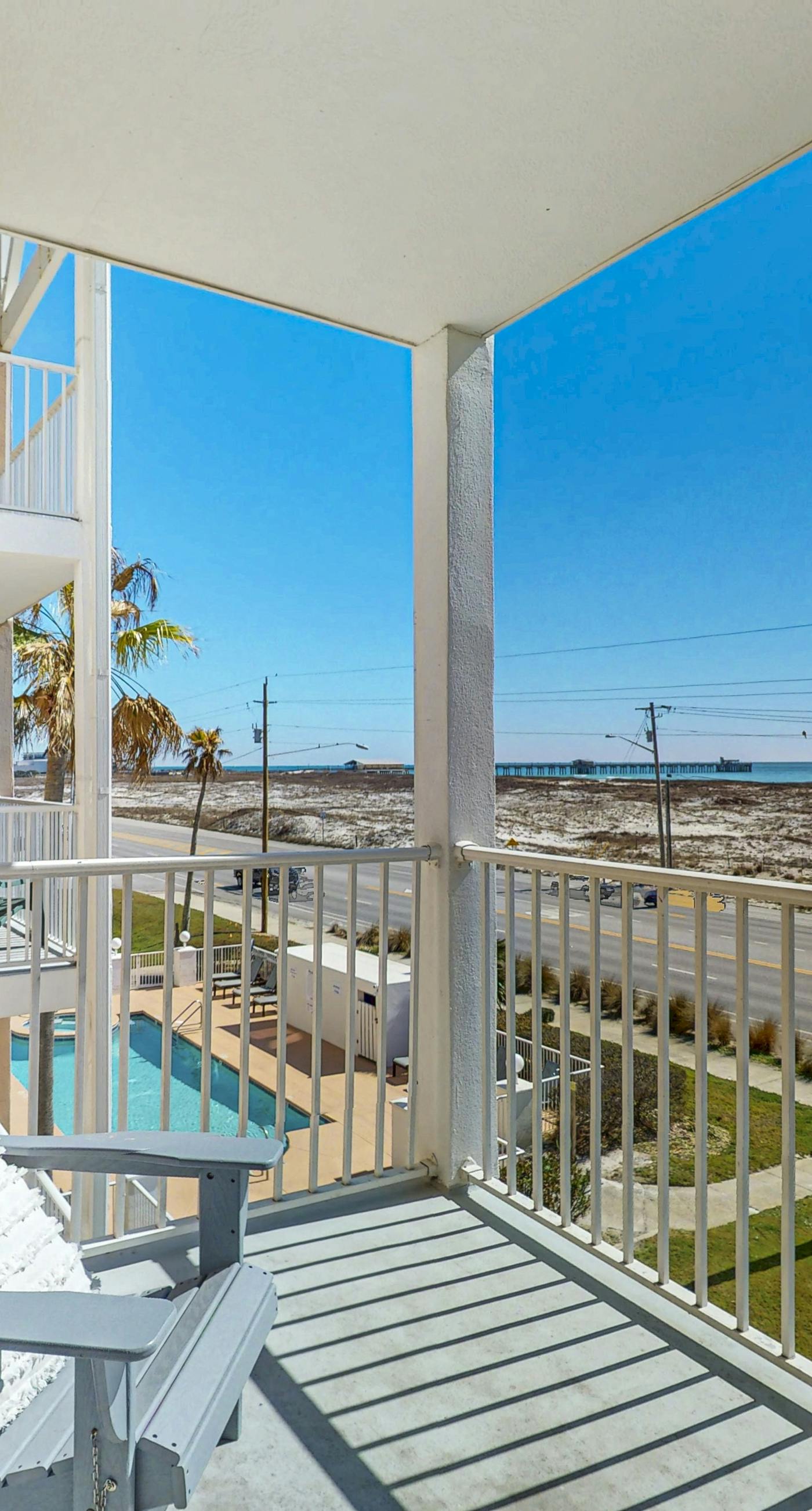 Beachfront condo with pool, private balcony, and washer and dryer