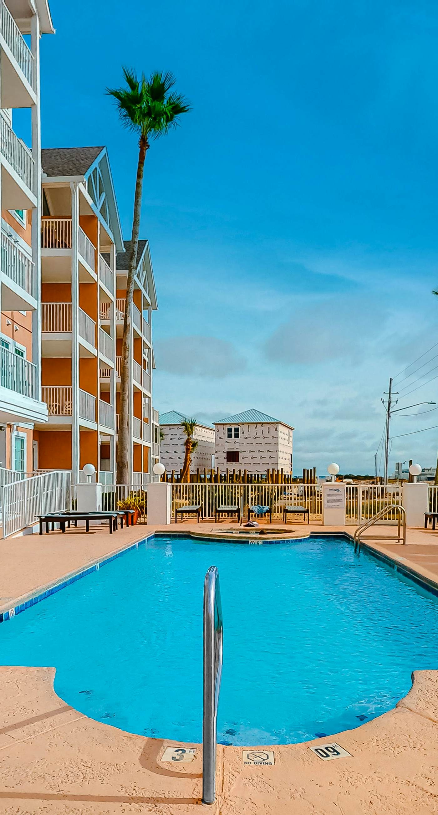 Beachfront condo with pool, private balcony, and washer and dryer