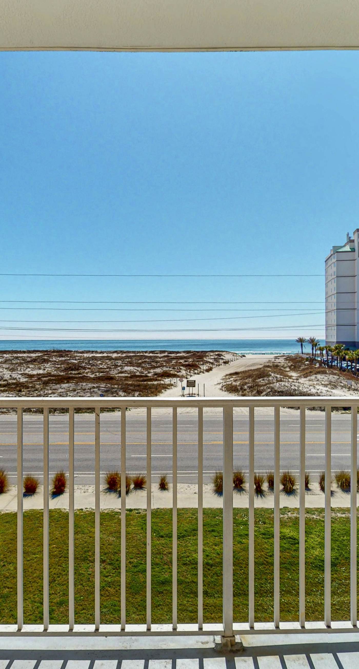 Beachfront condo with pool, private balcony, and washer and dryer