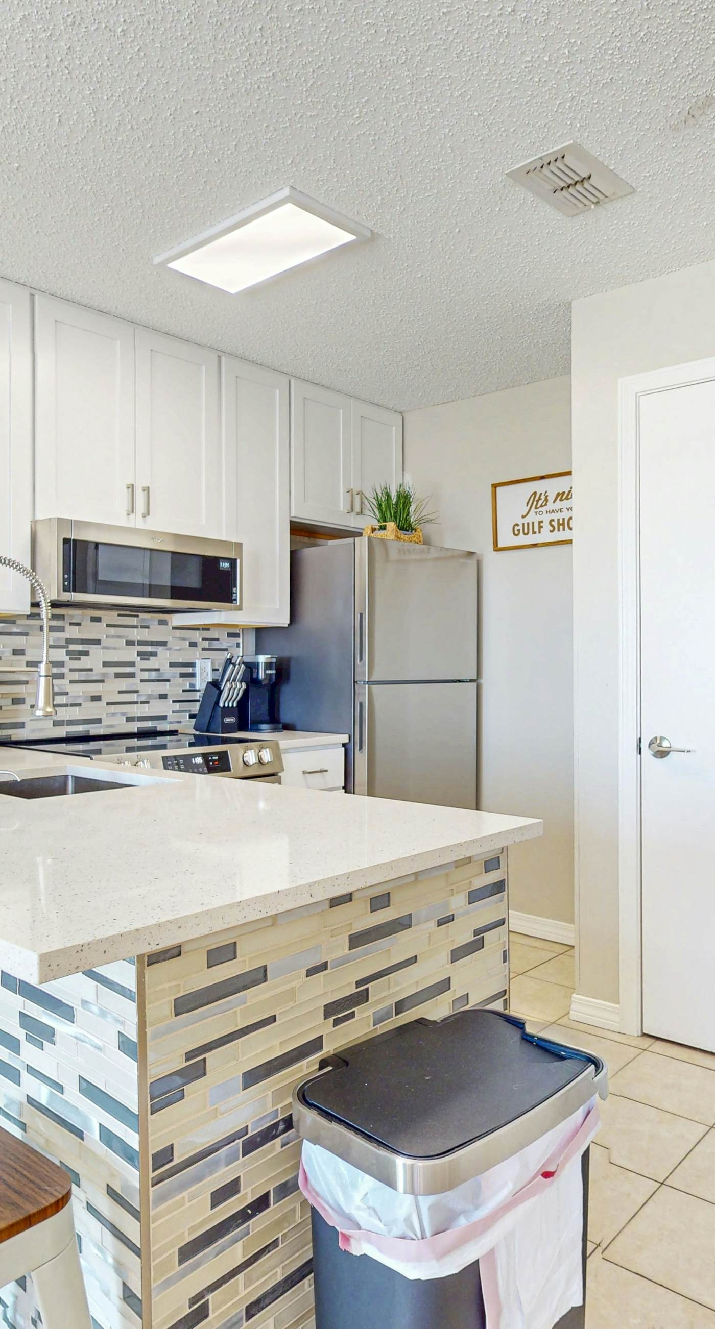 Beachfront condo with pool, private balcony, and washer and dryer